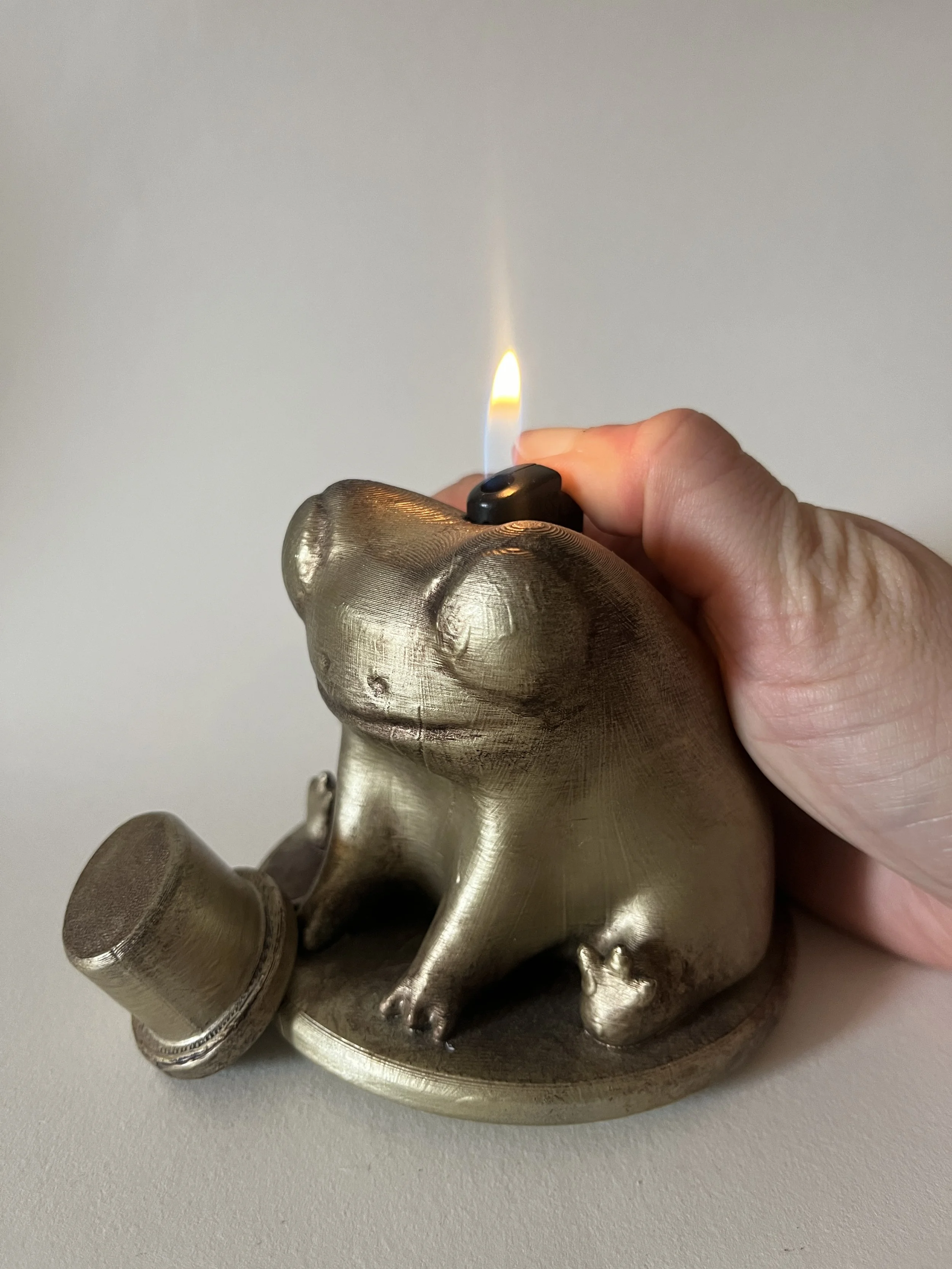3D printed and hand painted table lighter of Fred the frog with a tophat - April 2024