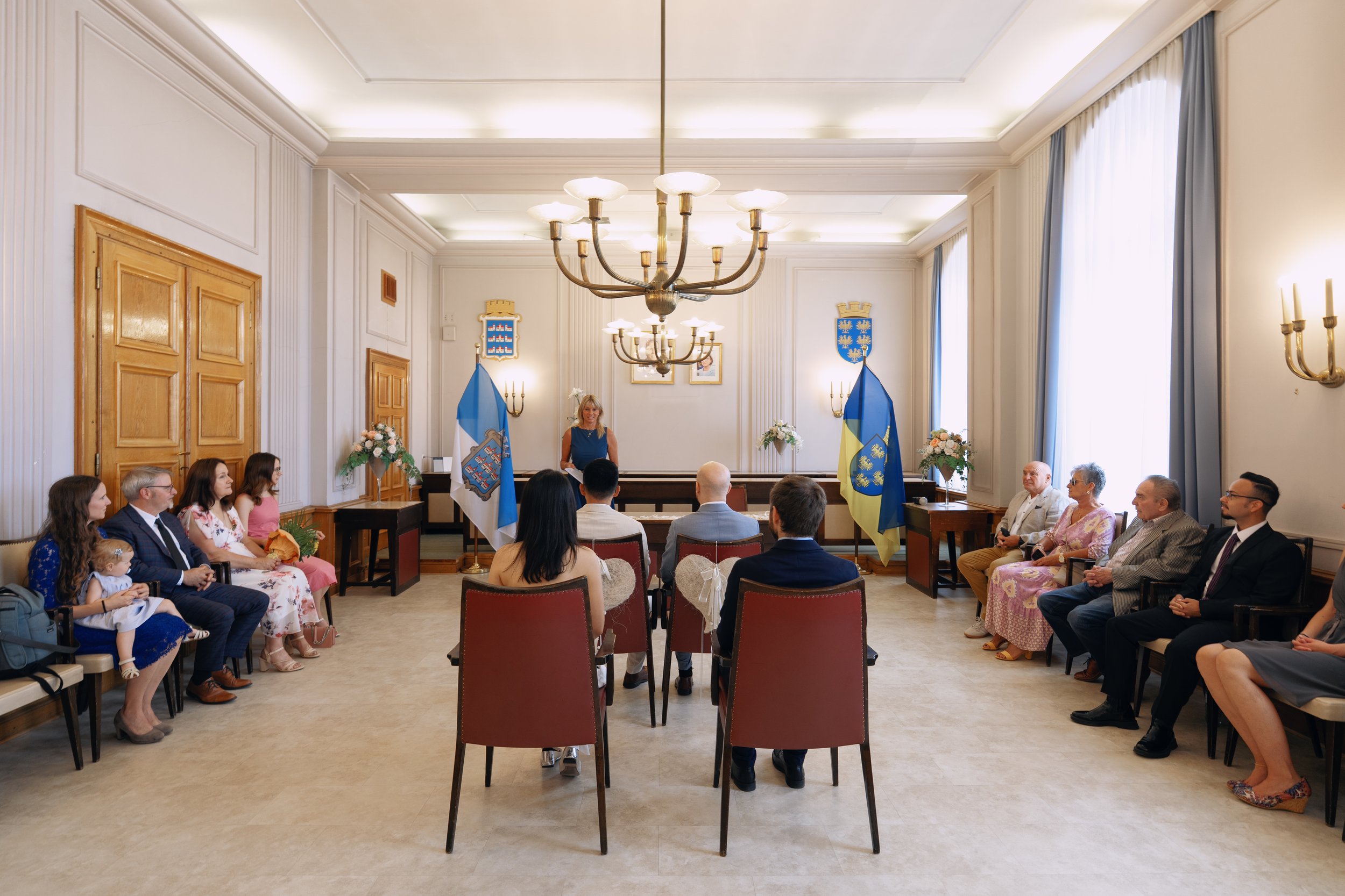 Guests attending a civil wedding ceremony of a same-sex couple near Vienna.