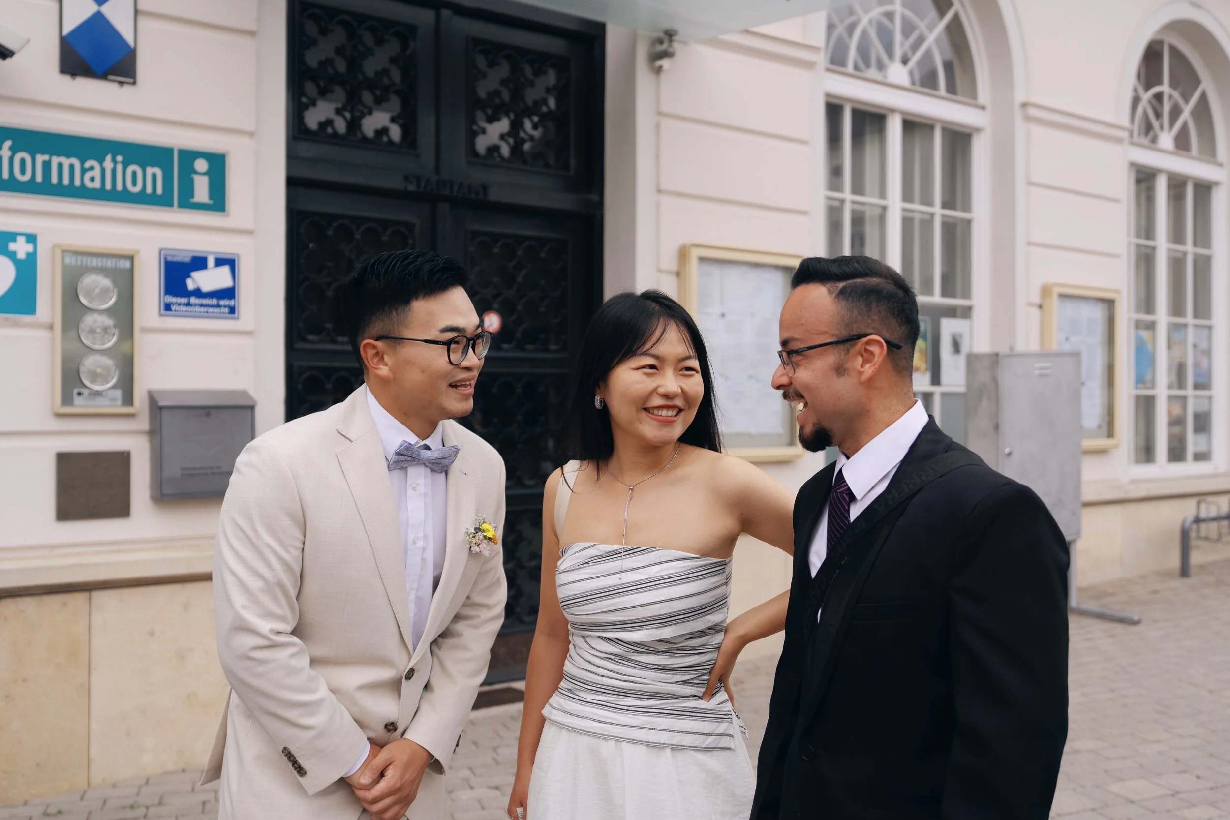 The newlyweds celebrating with friends after their civil wedding ceremony.
