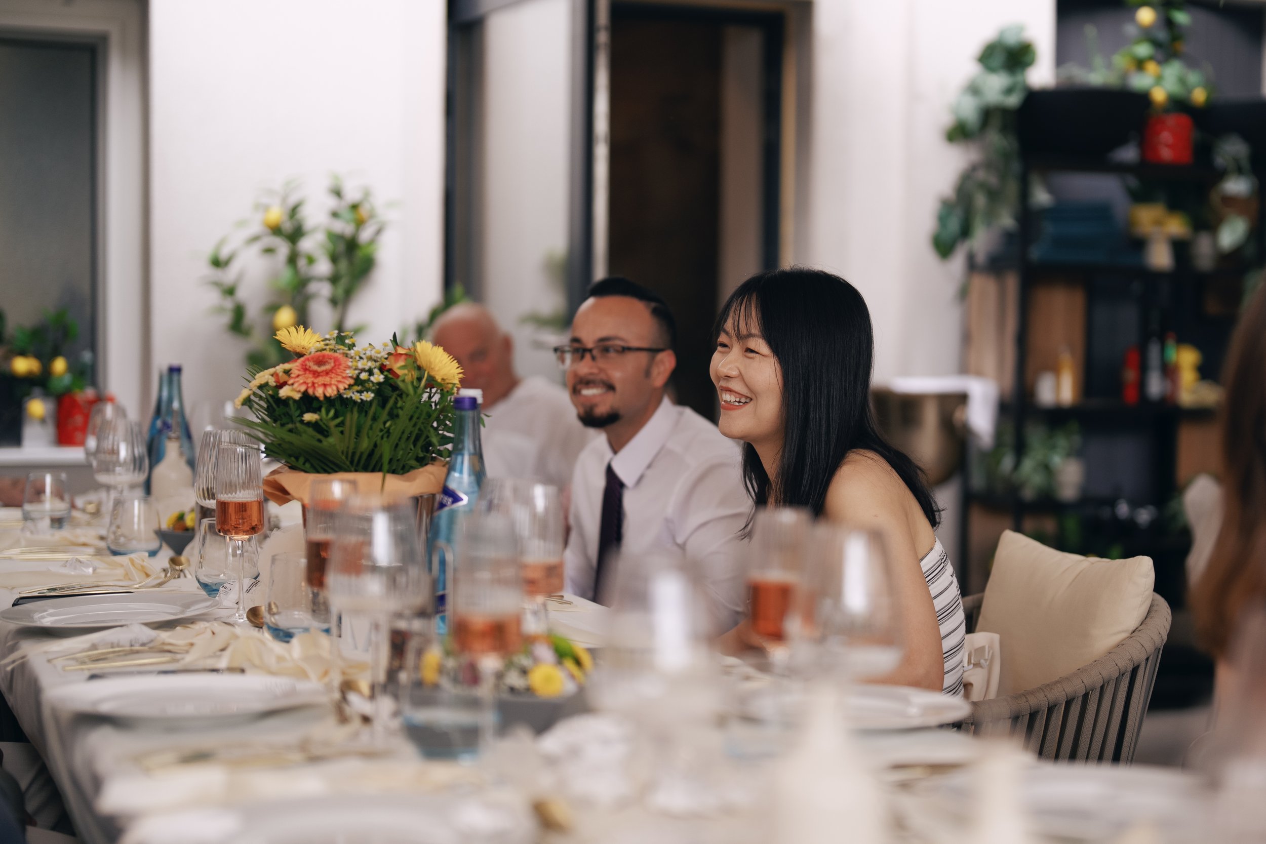 Wedding guests enjoying the reception together.