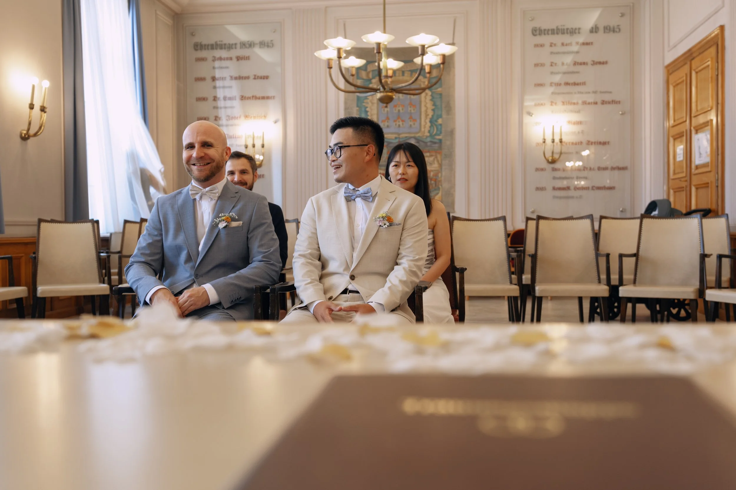 wo grooms smiling together during their civil wedding ceremony.