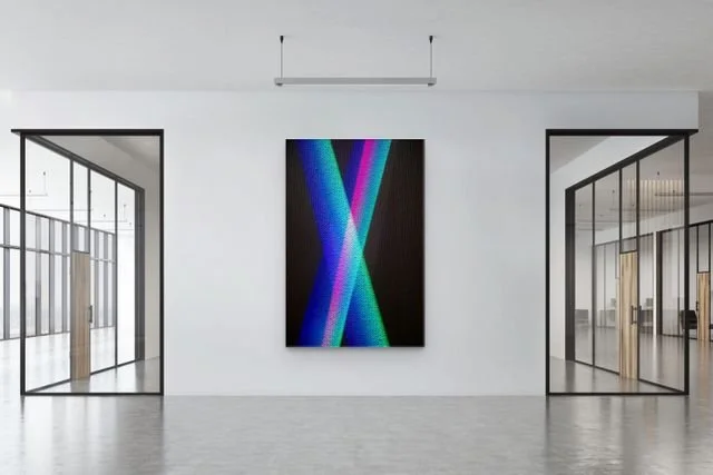 Modern minimalist gallery hallway with colorful abstract artwork between glass-walled rooms