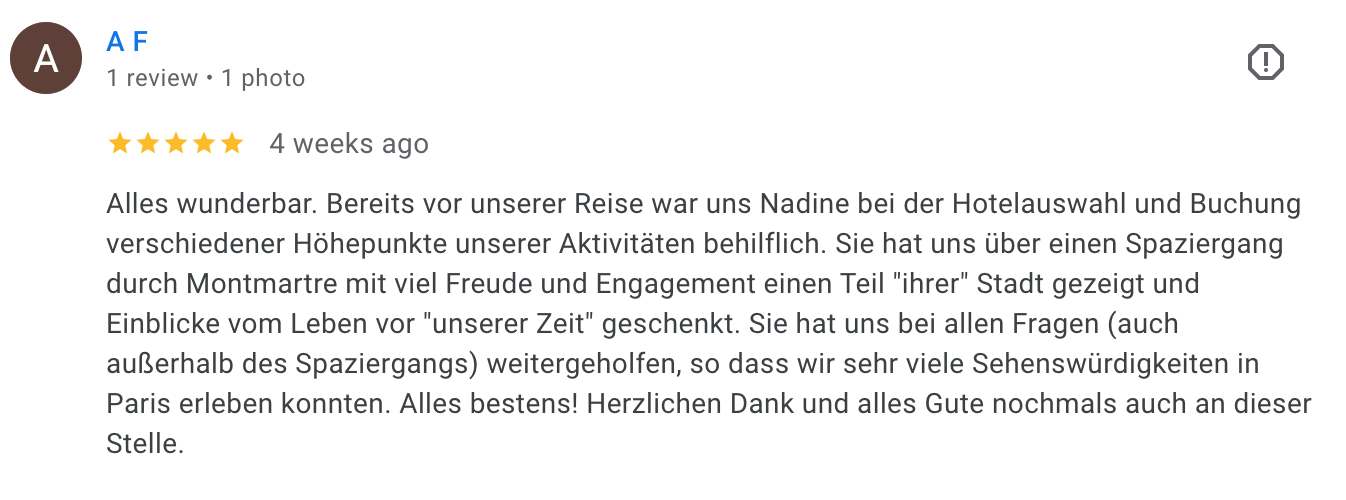 Screenshot of a German-language travel review on Google, with five-star rating and a detailed positive experience about a walking tour through Montmartre in Paris.