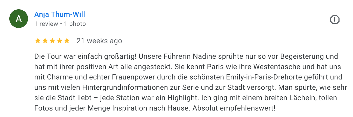 Screenshot of a 5-star review written in German about a guided tour of Paris, mentioning the tour leader Nadine, her positive attitude, knowledge of Paris, and inspiring experience.