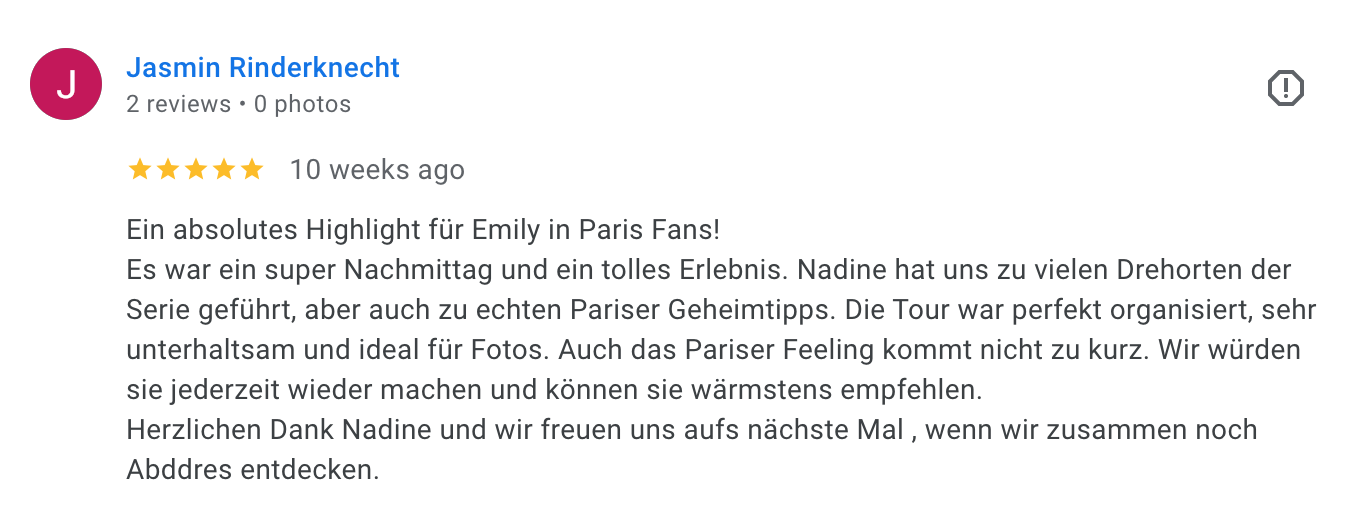 Online review for a tour in Paris, written in German, five-star rating, mentioning Emily, Nadine, and Paris highlights.
