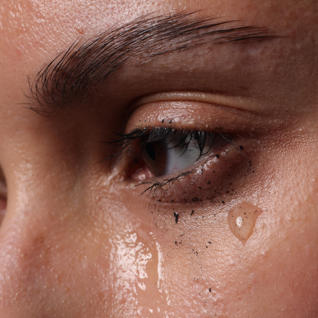 Close up of a womans eye watering