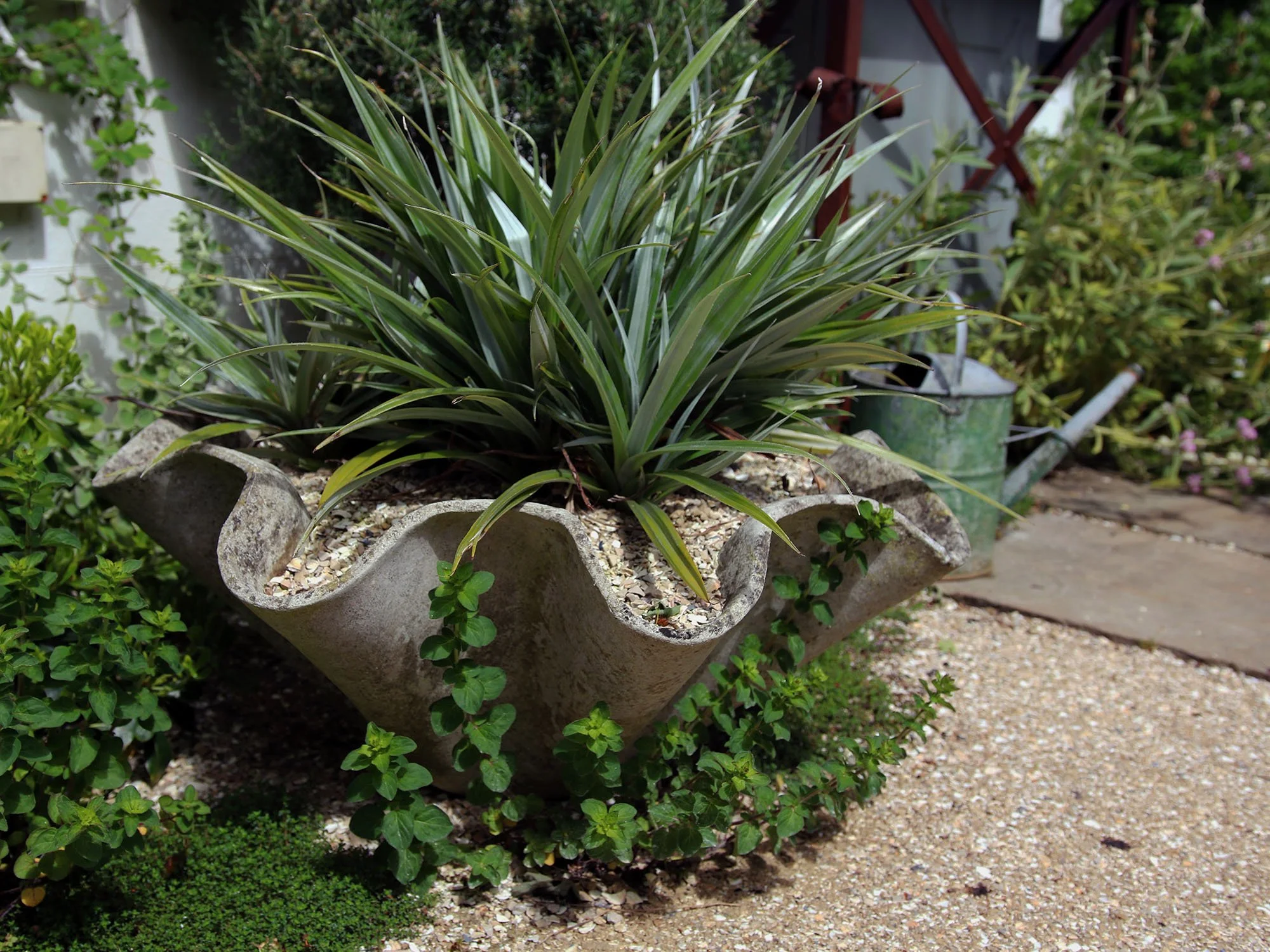 We are able to select individual pieces of furniture and pots to set off your garden to its best advantage.