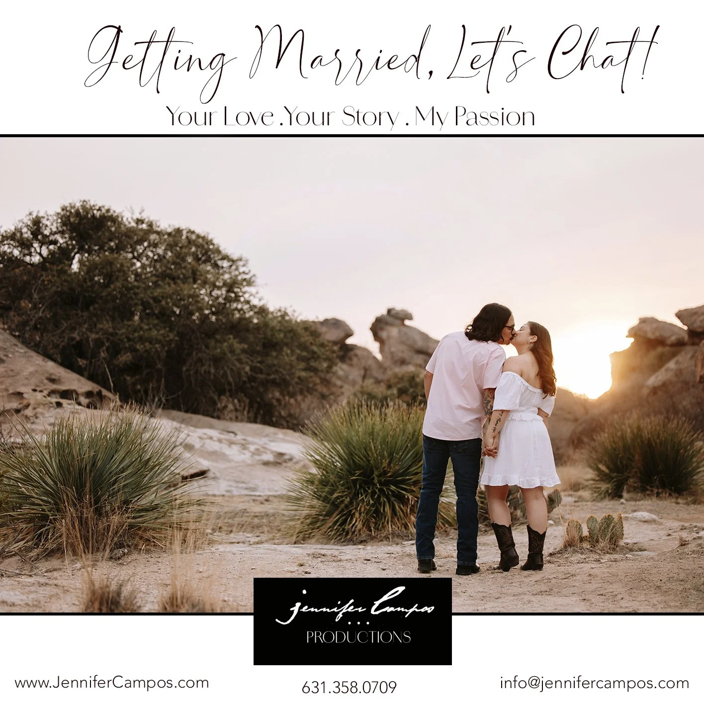 A couple kissing in a desert landscape at sunset, holding hands, with bushes and rocks around them.