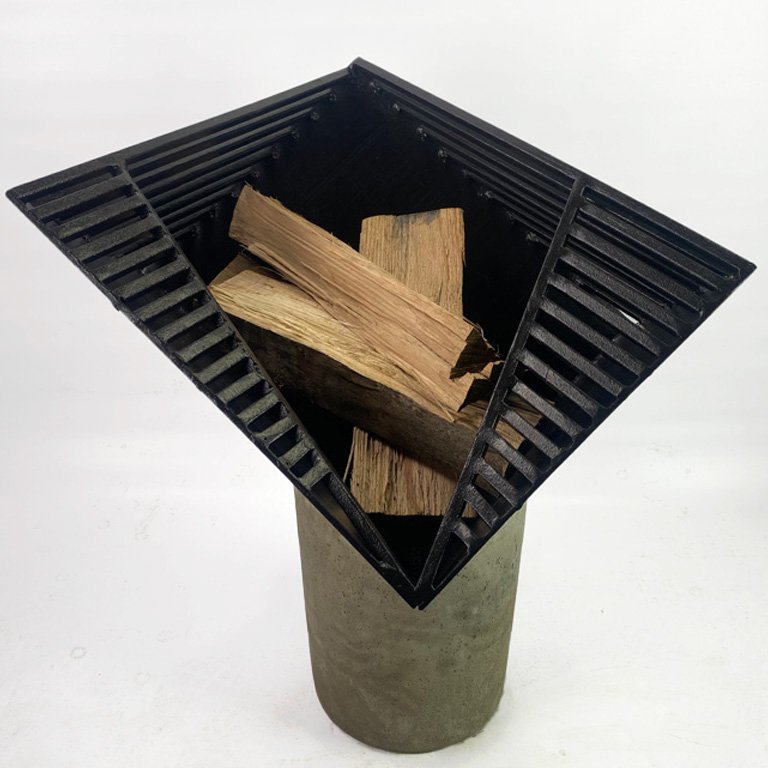 Introducing Viewpoint - Firepit, a modern and sleek addition to your outdoor space. Handmade with steel and concrete for an angular, geometric design that provides a unique perspective on fire. The slits allow light to shine through, creating a mesme