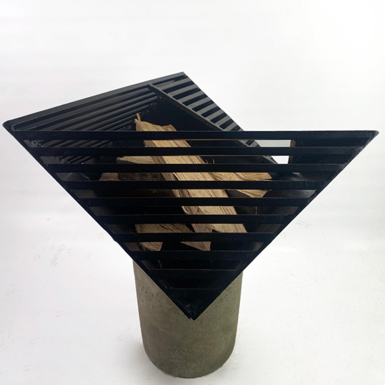 Viewpoint Firepit, a modern and sleek addition to your outdoor space. Handmade with steel and concrete for an angular, geometric design that provides a unique perspective on fire. The slits allow light to shine through, creating a mesmerizing view.