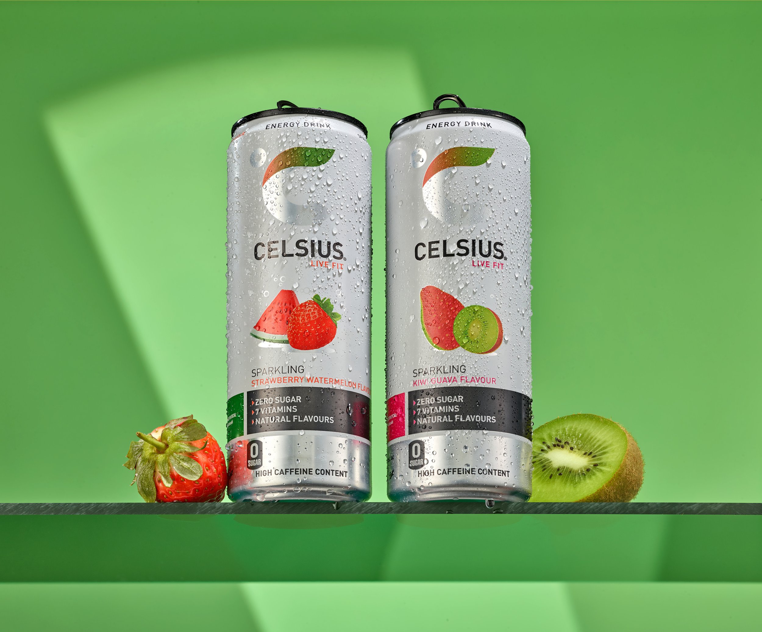 Still life product photography of two Celsius energy drink cans with ingredients shot in London studio