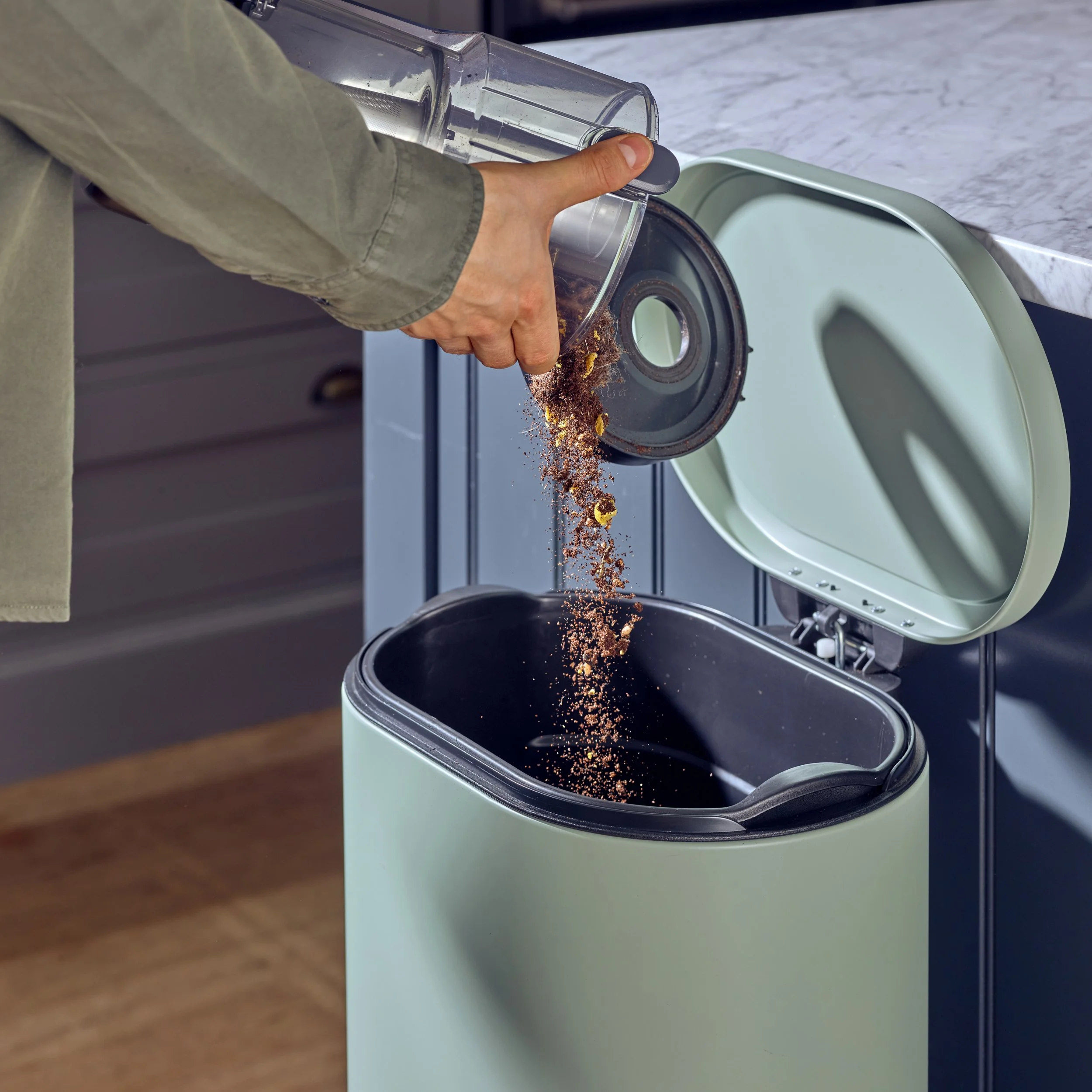 debris form hover is put in the bin commercial product photography