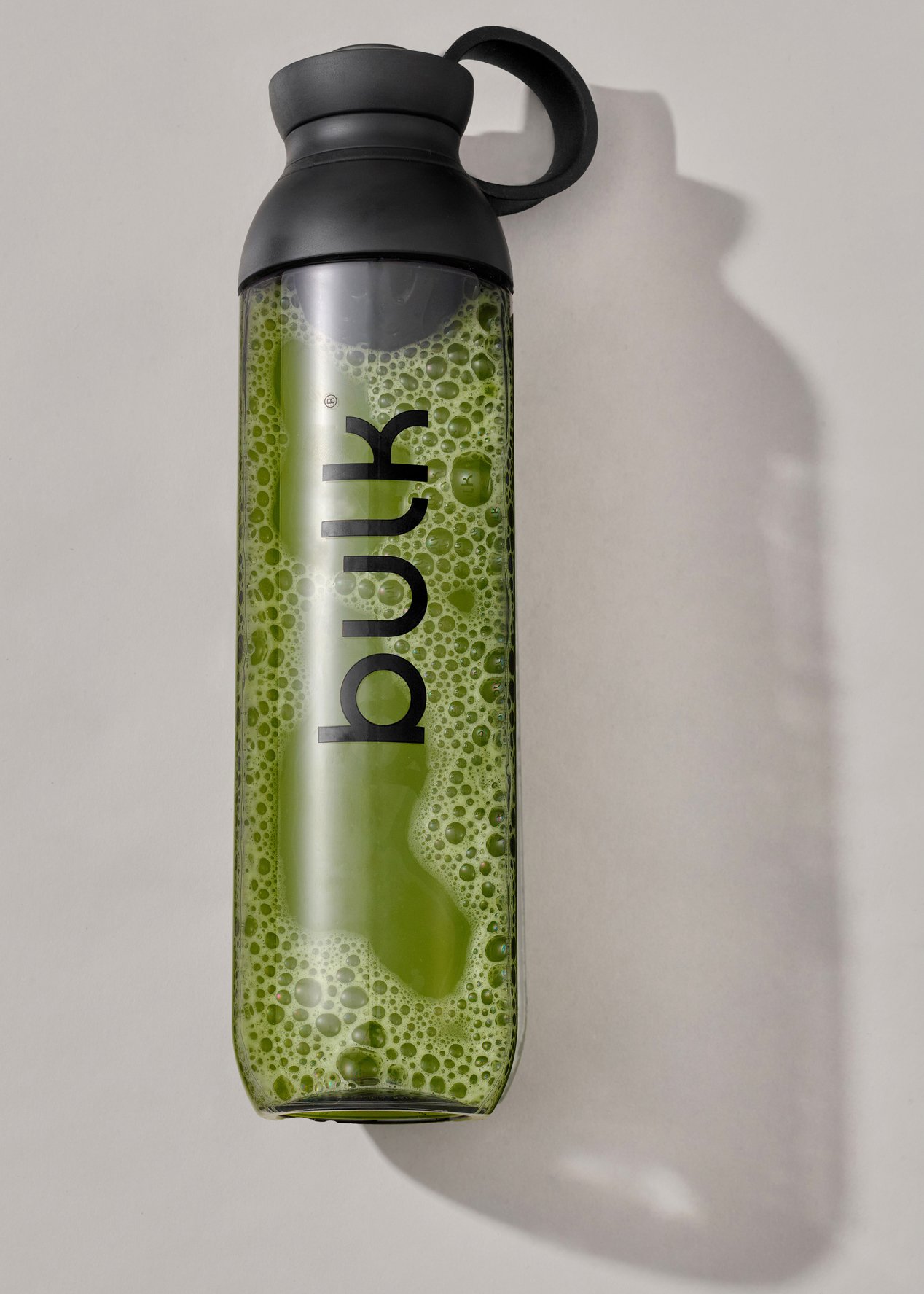 Bulk drinks container with liquid inside and shadow