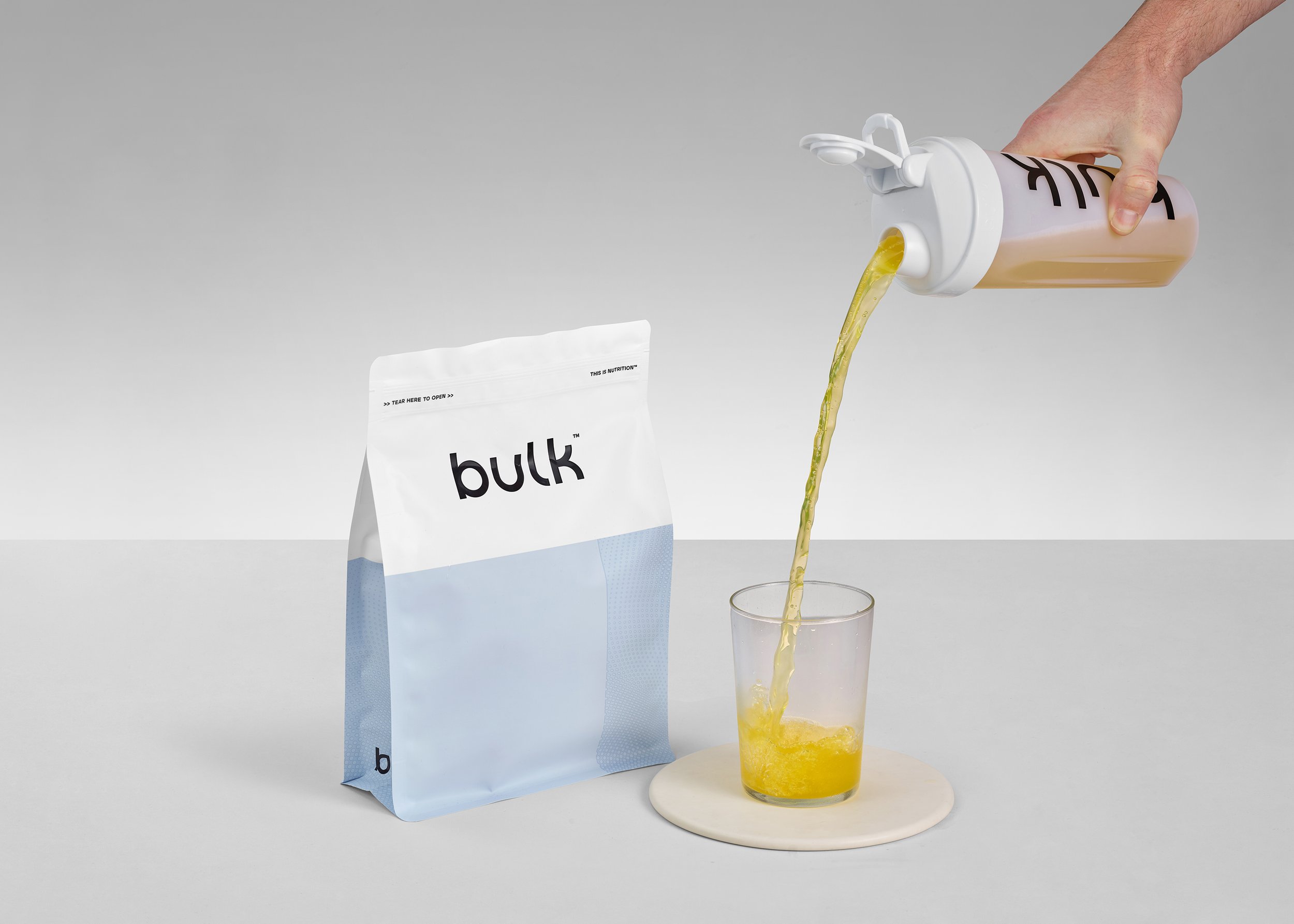 liquid pours into glass product drink photography