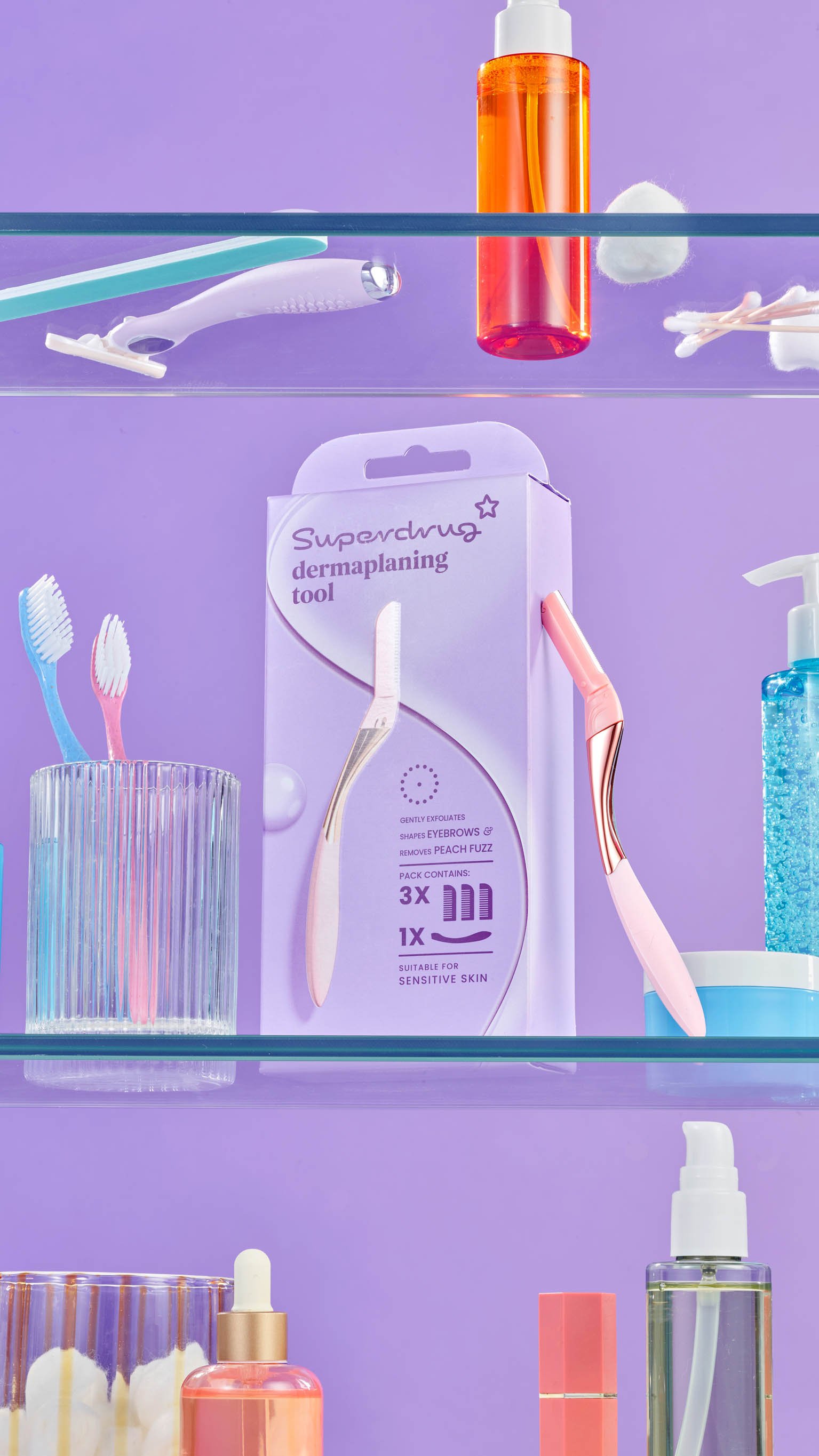 purple props and background as comsticproducts sit on bathroom shelf