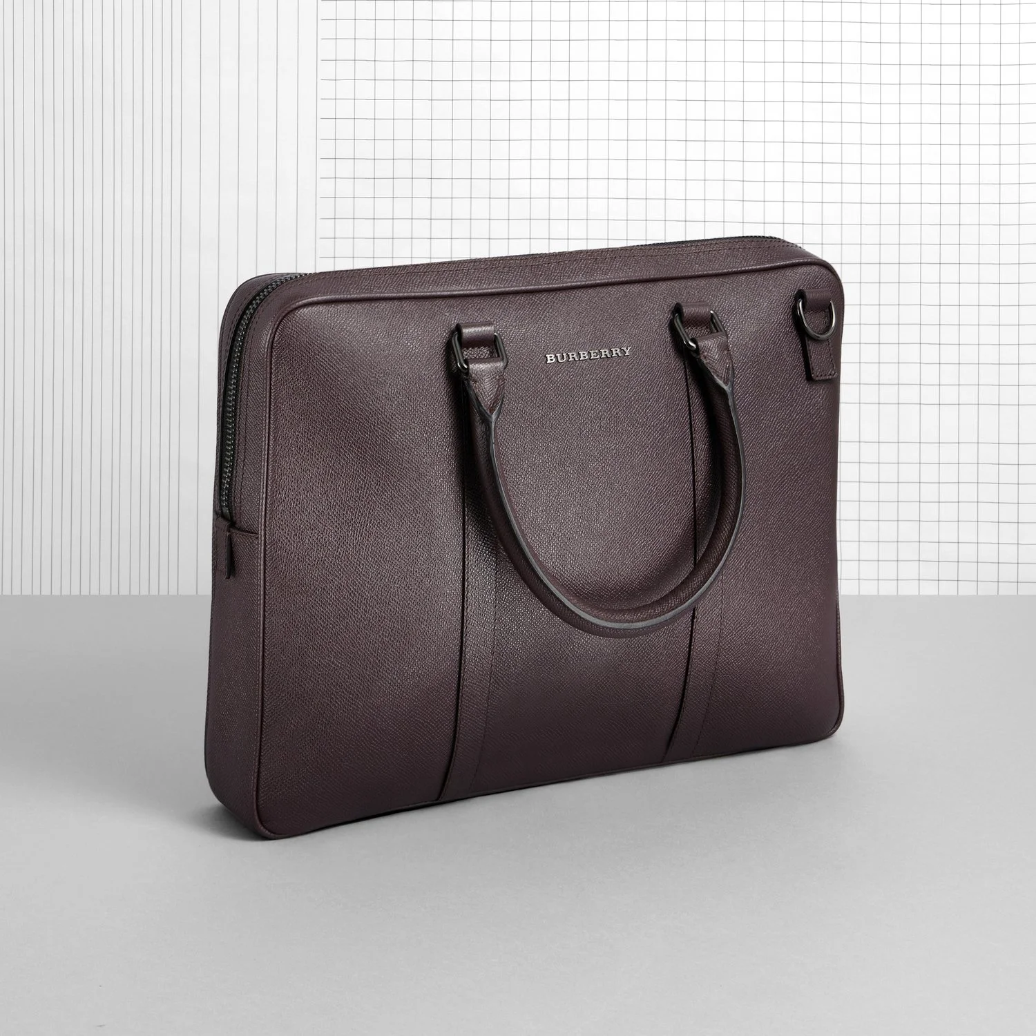 Burberry bag on a white background which graphic lined patten shot by packshot photographer Chris Howlett