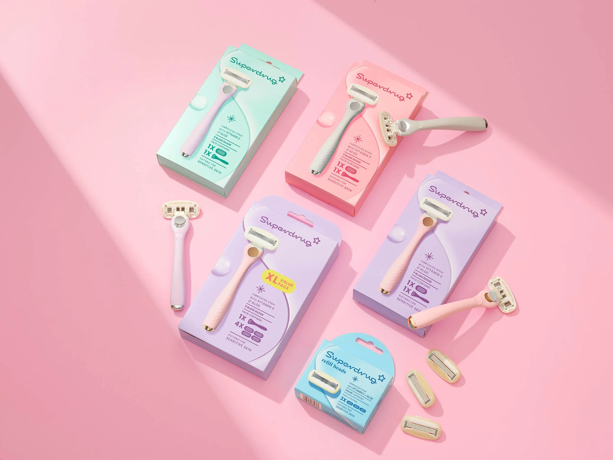pink background with shaft of light featuring overhead of products on pink graphic background