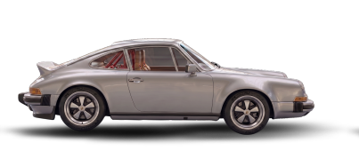 Side view of a classic silver Porsche 911 sports car.