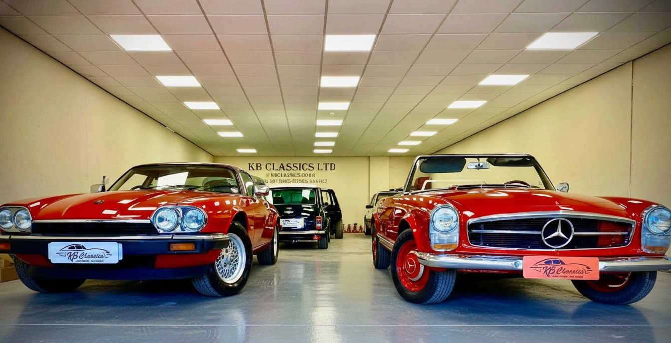 Inside a showroom with classic Mercedes-Benz cars, including a red 1970s Mercedes-Benz SL and other vintage vehicles.