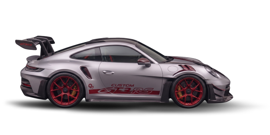 Silver and red Porsche 911 GT3 RS race car with custom stickers, red wheels, and a large rear wing.