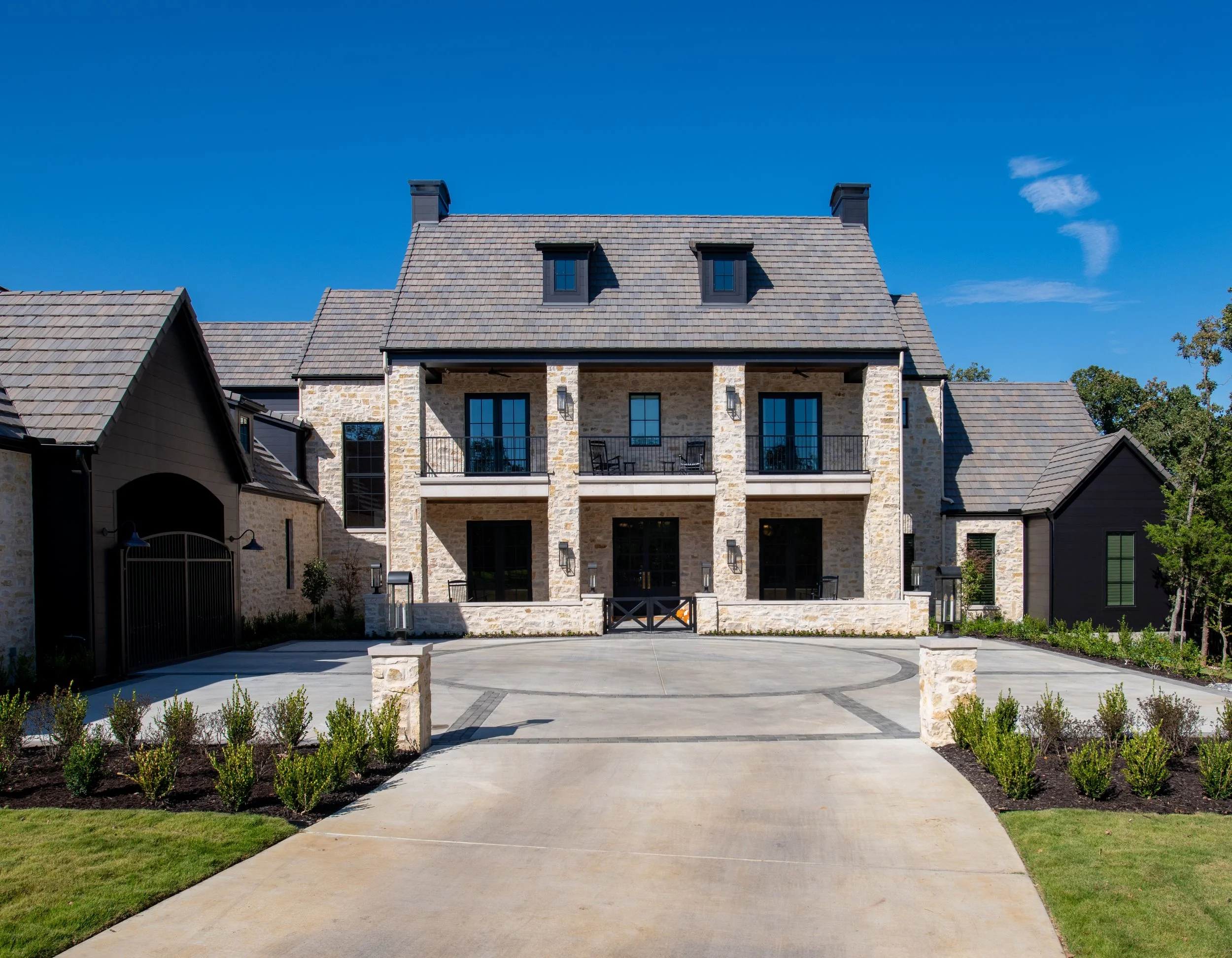 Front exterior of 3304 Hidden Trail custom luxury home in Southlake, TX by WillowTree Custom Homes.