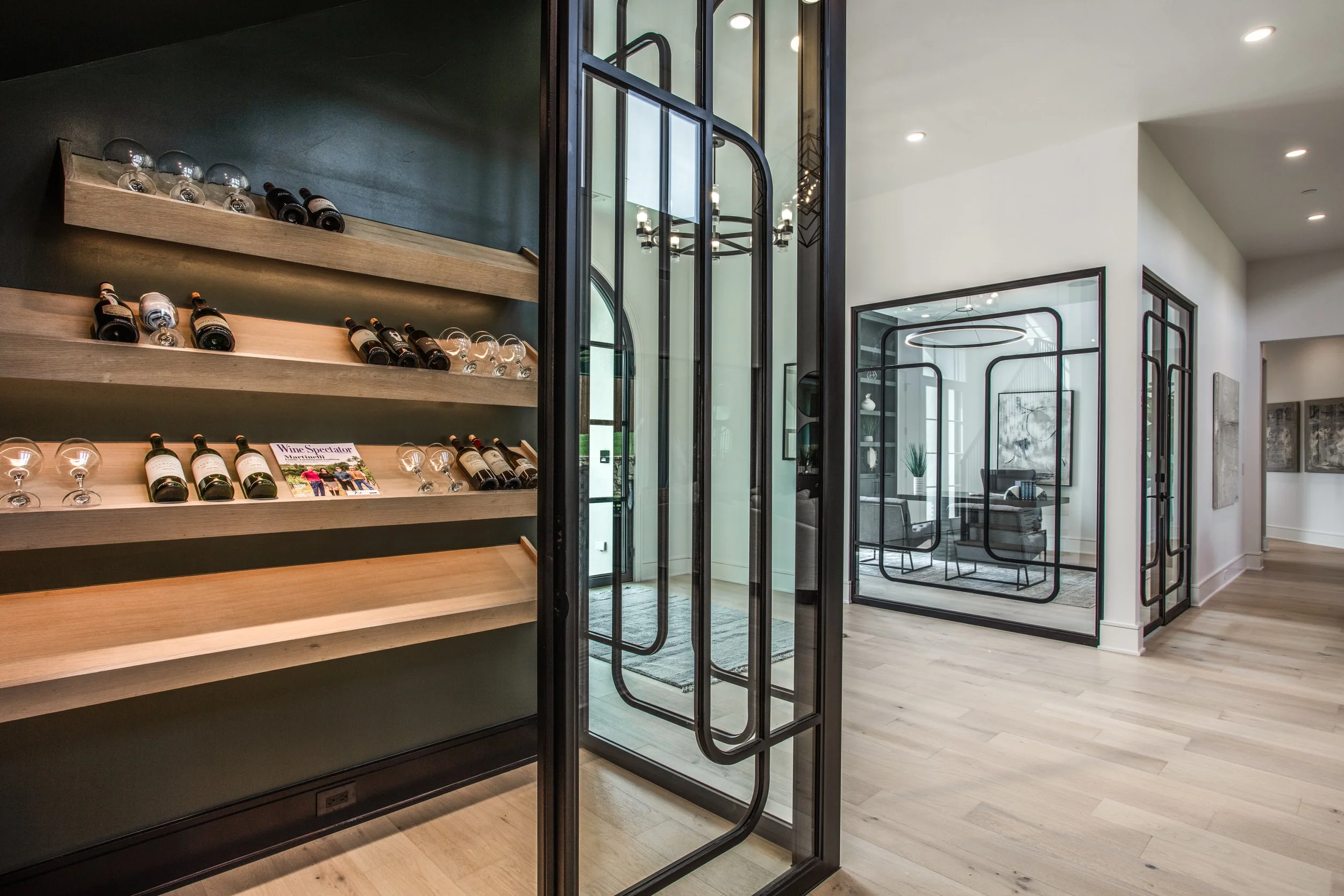 Custom wine display and steel-framed glass office in a WillowTree custom home, Southlake and Fredericksburg builder.