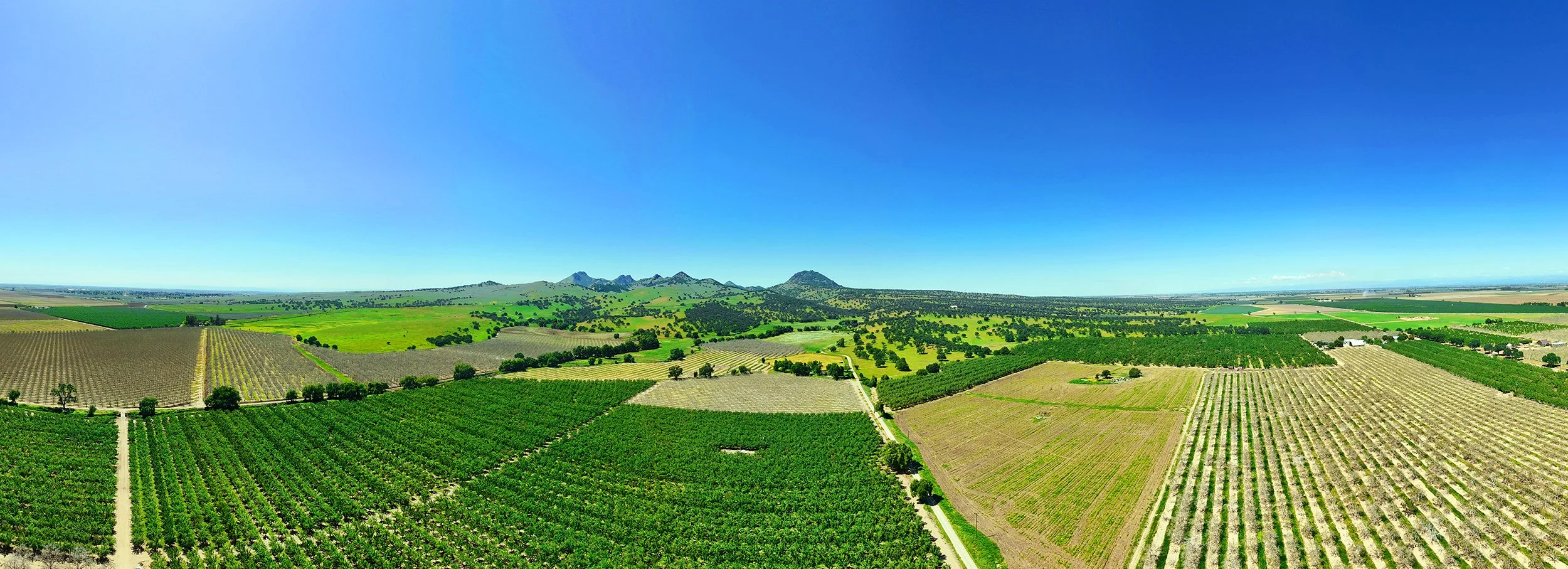 Professional real estate media by Volo Foto — photography, video, virtual tours, floor plans, and FAA Part 107 certified drone services in Sacramento, Elk Grove, Galt, and Lodi — drone arial panorama of Sutter Buttes.