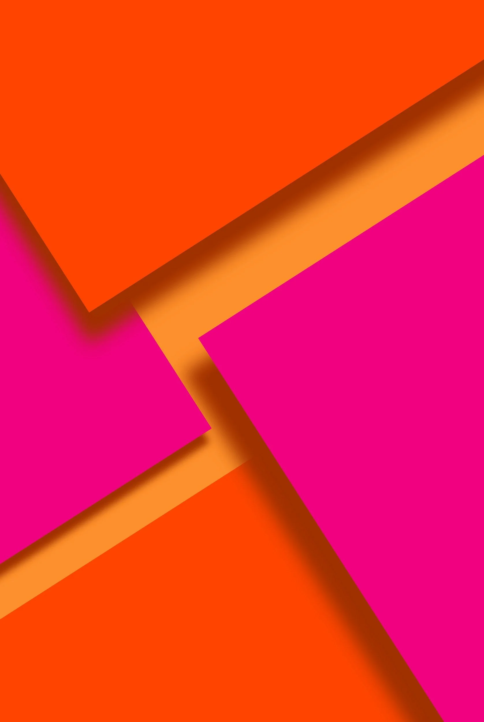 Colorful geometric abstract background with overlapping pink and orange paper-like shapes.