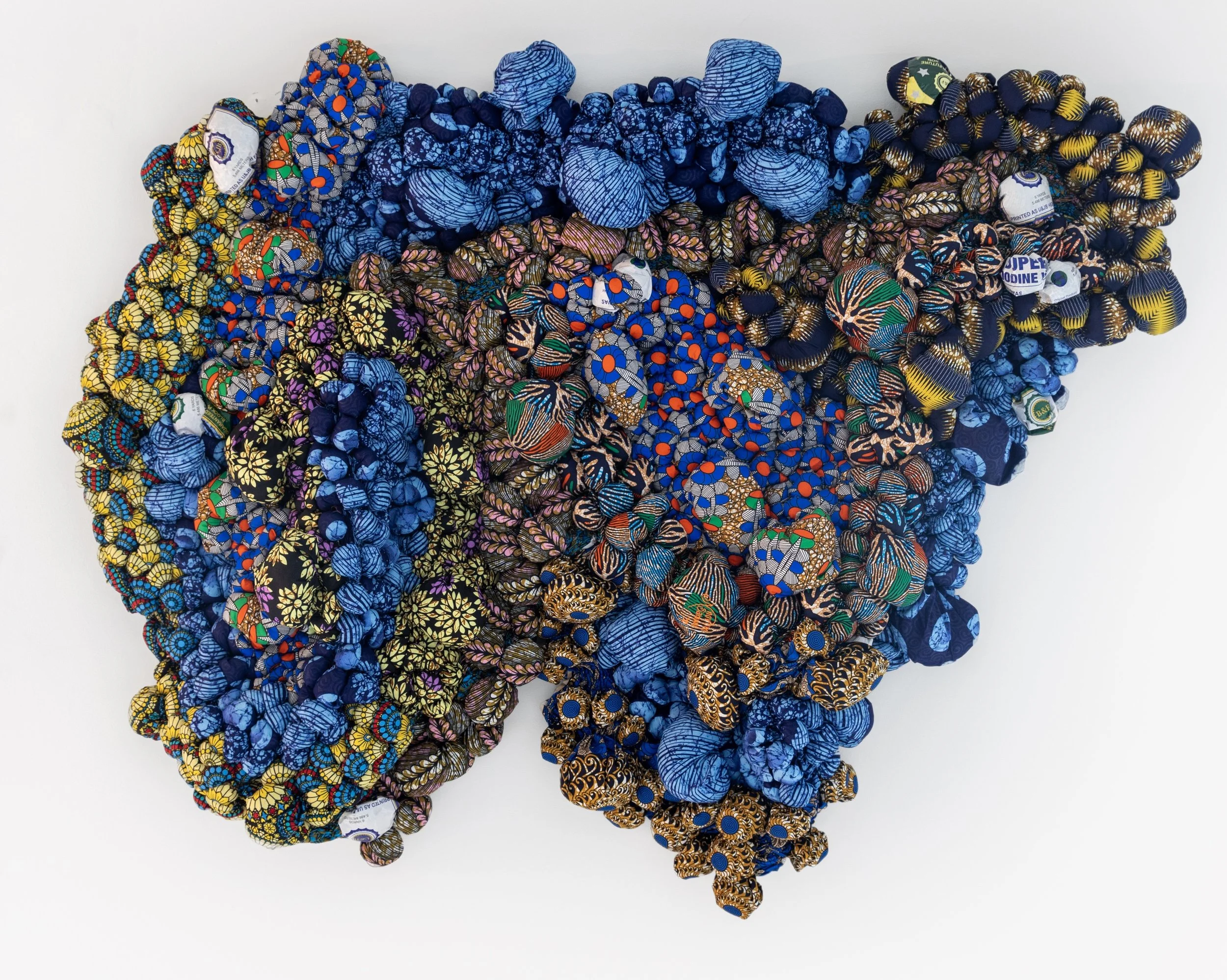 Questions Unasked, 2025, African Wax Print Fabric, 67" x 48 3/4" x 9"