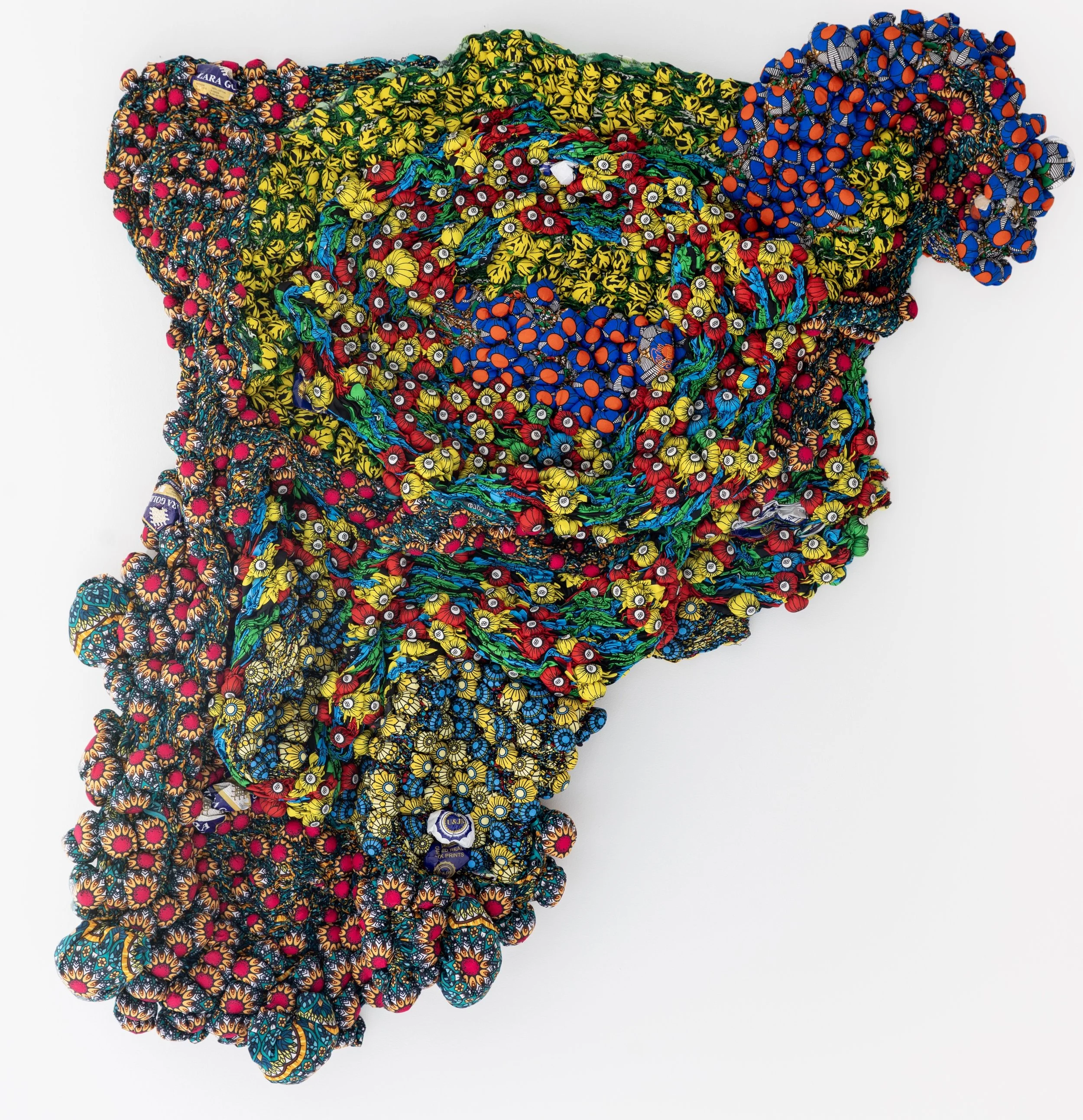 Beauty Comes in Warm Touches, 2025,
African Wax Print Fabric,
54" x 56" x 7 3/4"