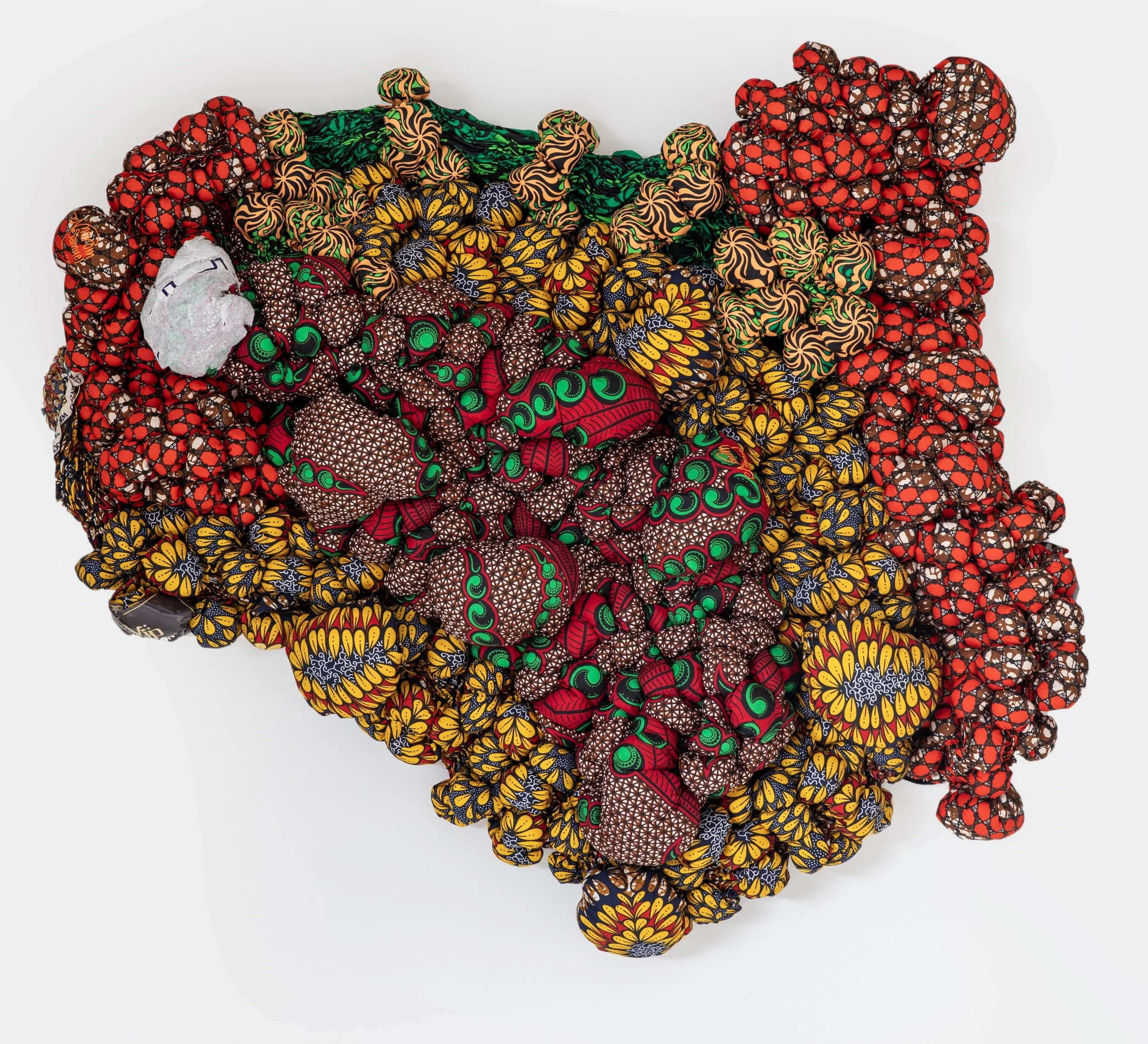 Layers of Applause, 2025,
African Wax Print Fabric,
35" x 35" x 8 1/2"