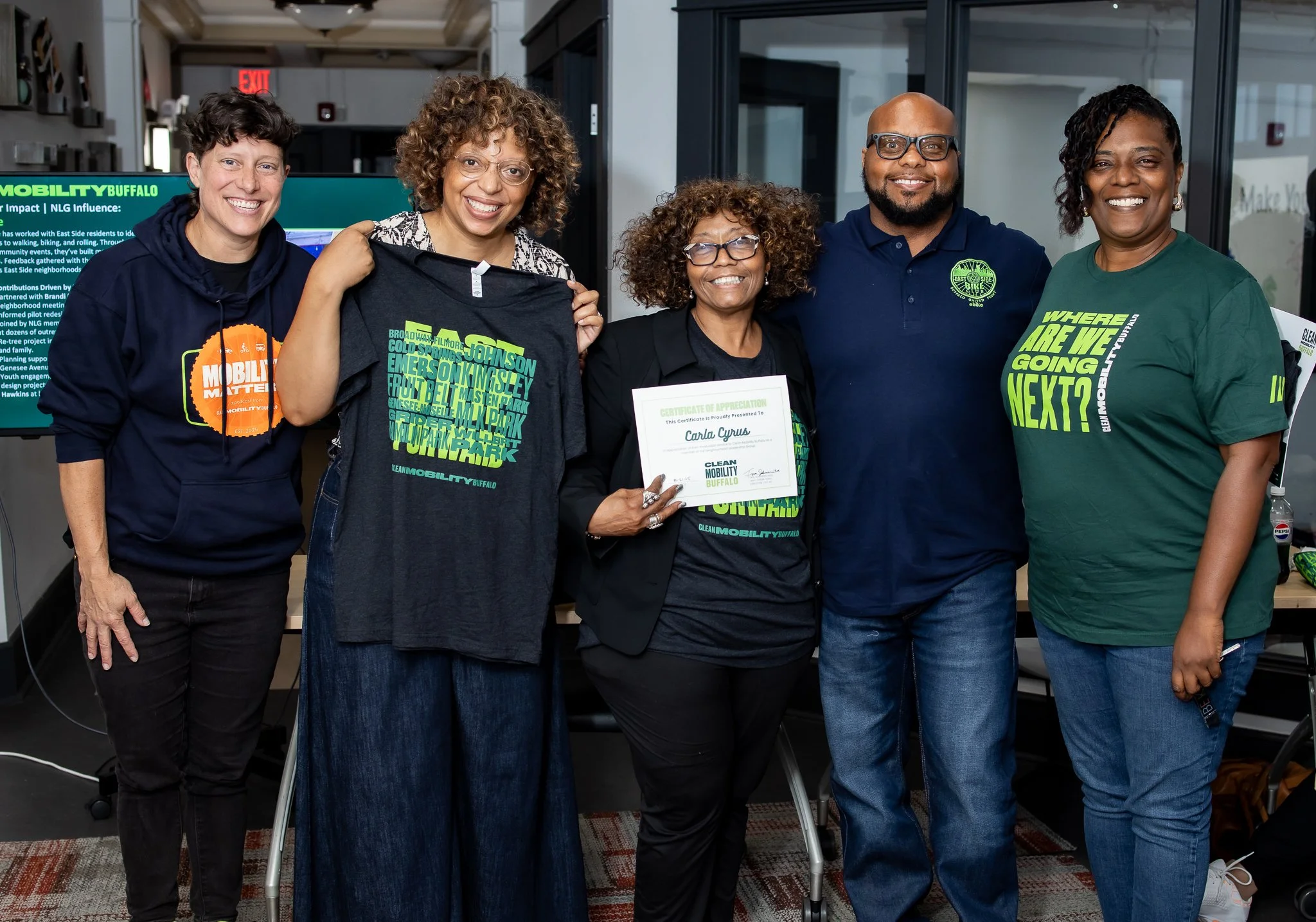 
Neighborhood Leadership Group — A group of people standing for a photo celebrating Carla Cyrus for being a part of the neighborhood Leadership Group.