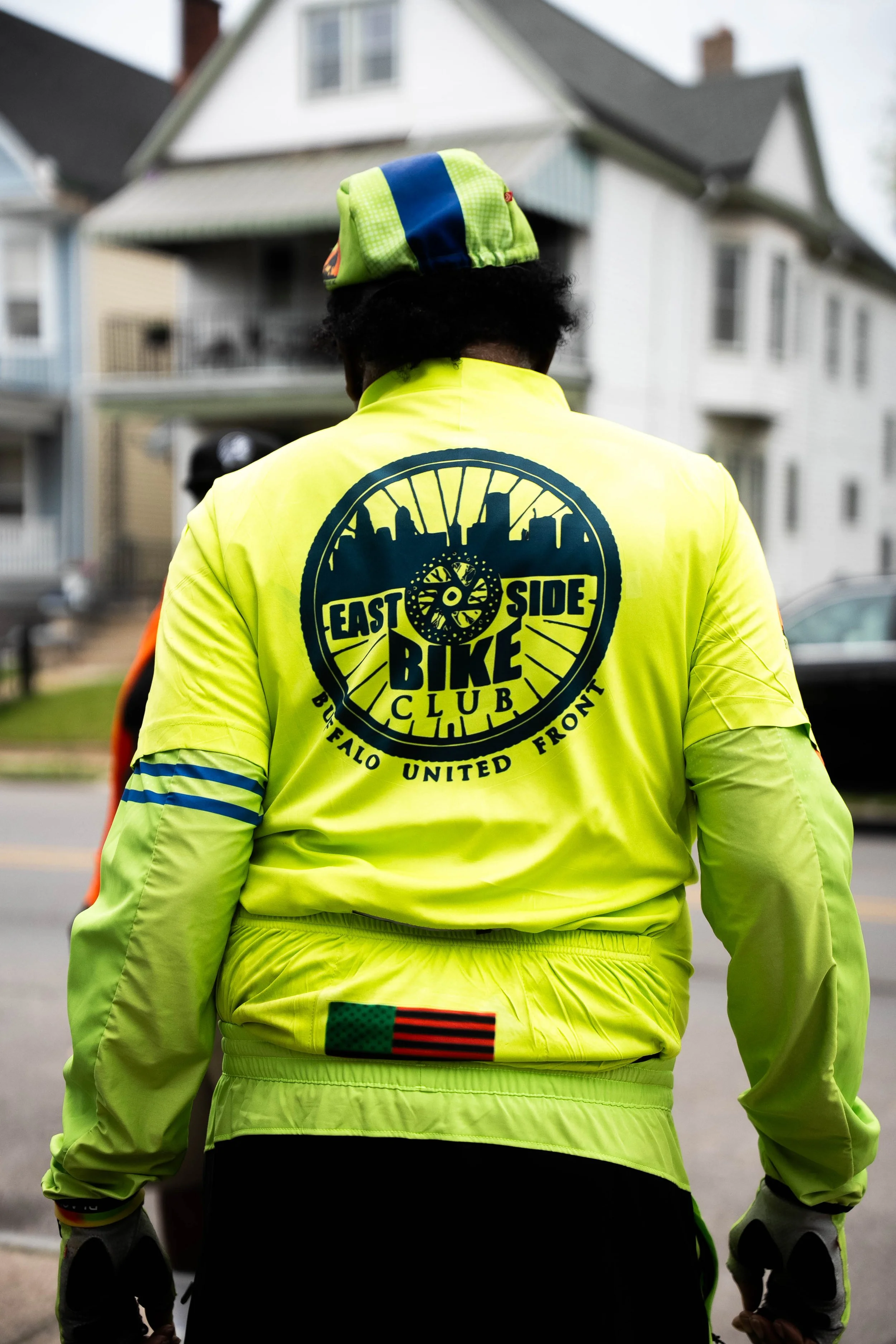 East Side Bike Club E-bike Library Grand opening — An image the back of someone's shirt that is the East Side Bike Club Logo.