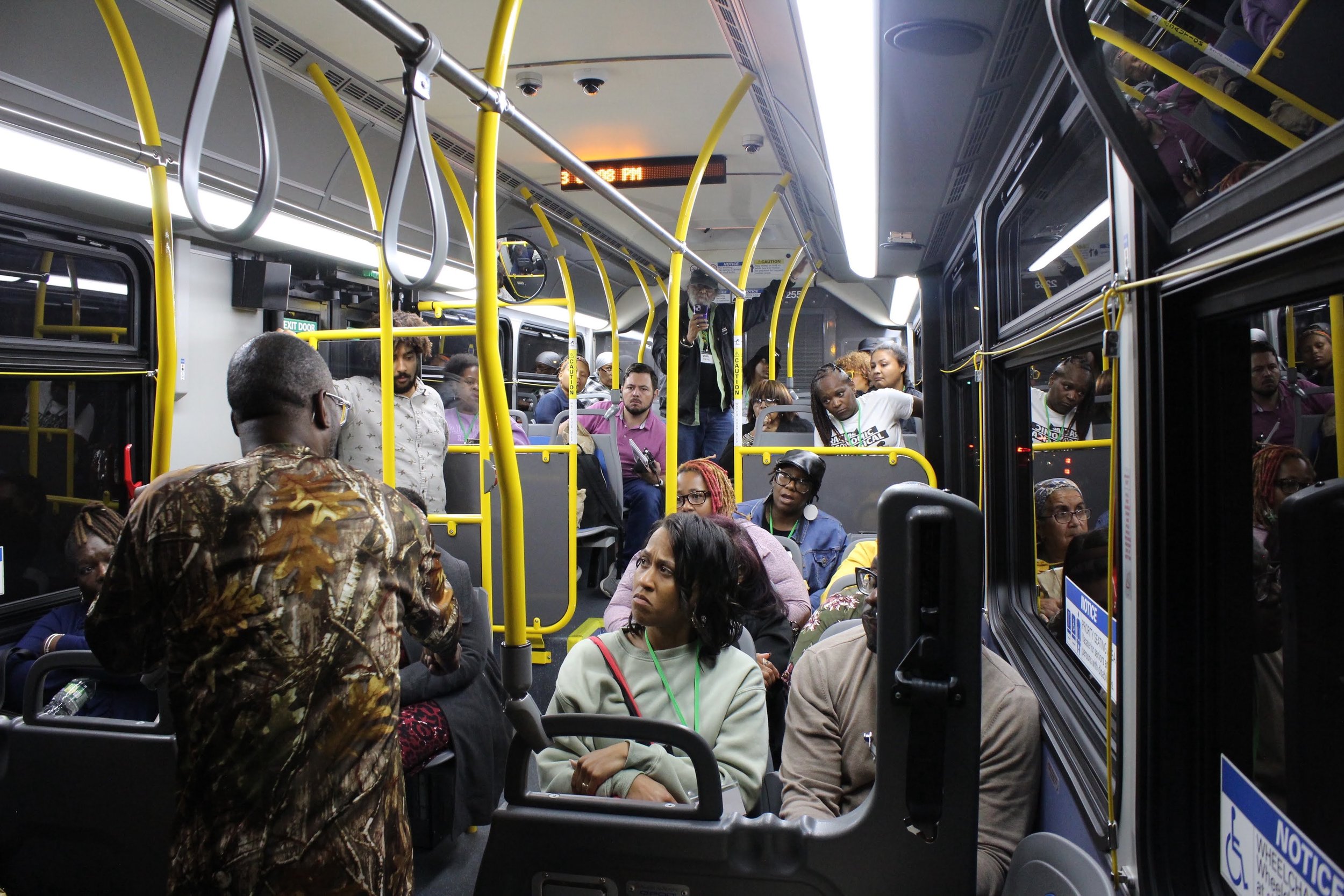 Clean Mobility - Neighborhood Leadership Group - Eco Justice Bus Tour 8/30/2023 — A group of people on a bus.