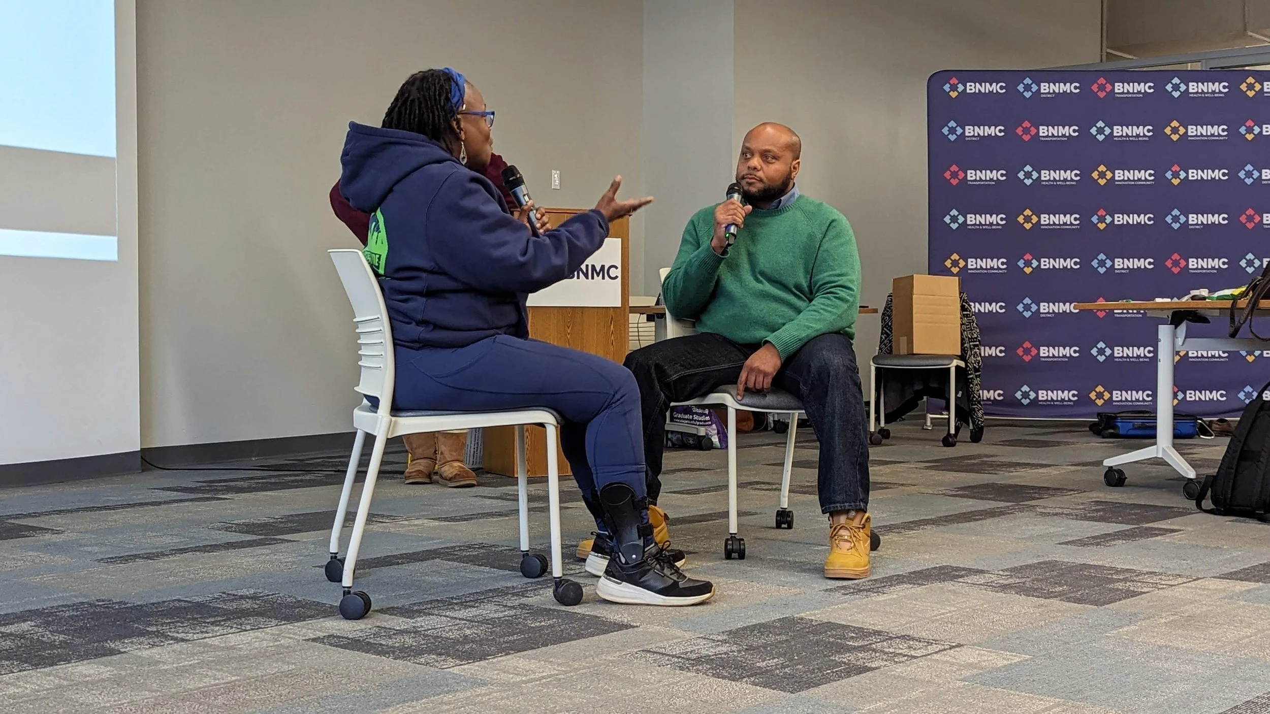 Race, Power, and Privilege Training 11/2/23 — A photo of two people speaking to each other.