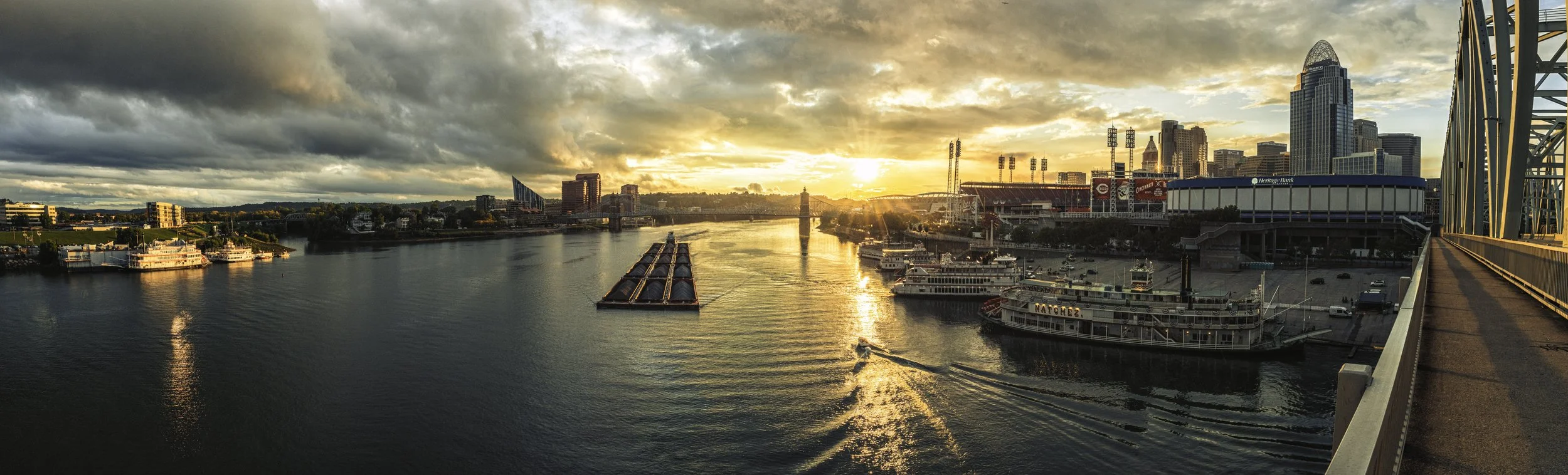 Sunset view of the steamboats and other river traffic on the Cincinnati Riverfront during the 2025 America River Roots Festival.
