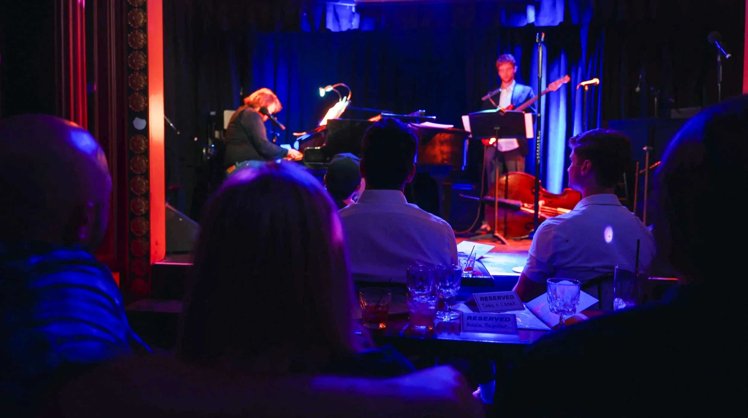 An audience listening to Jonny Rosch and Neal Perrine during A Night at the Triad.