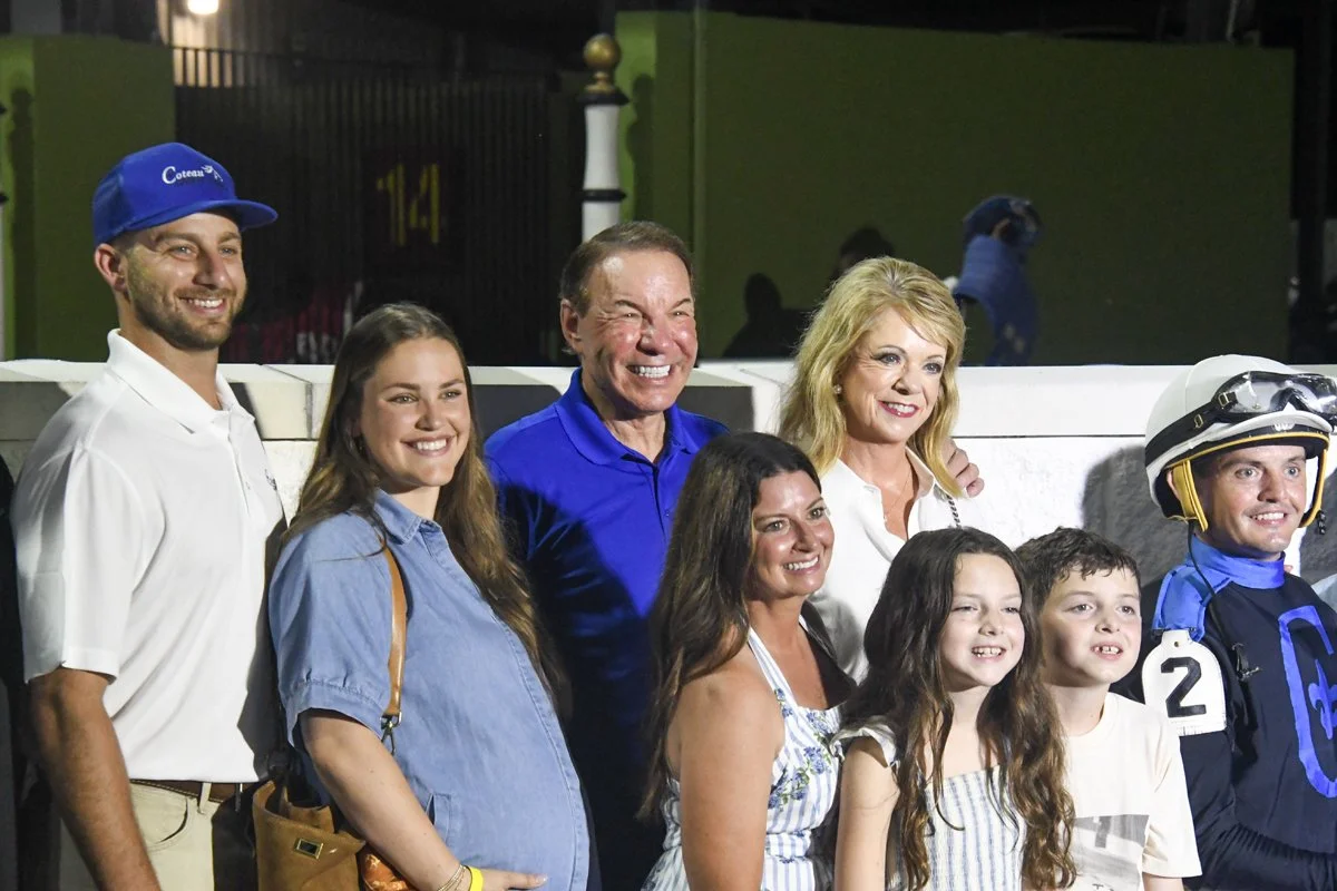 Coteau Grove Farms celebrating in the winners circle.