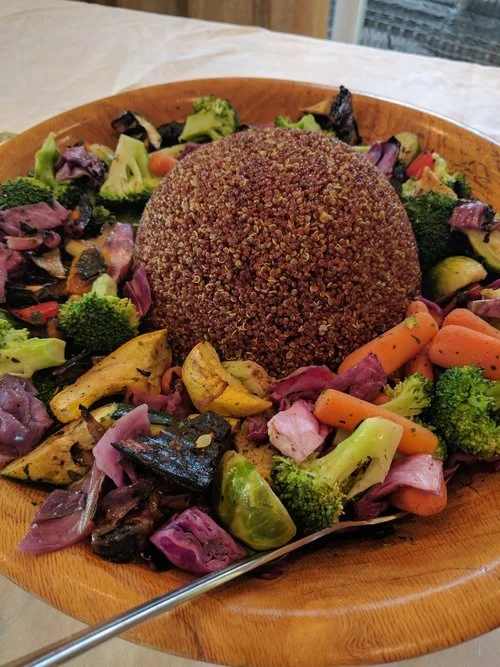 Curry Quinoa and grilled vegetable salad, one of Chef Ian's delicious vegan options, offering a colorful and healthy choice for guests.