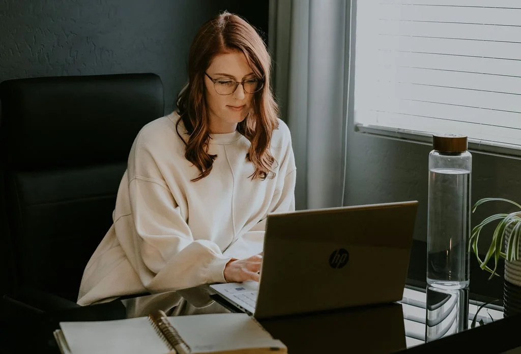 Ashlee, owner of BRYWELL, writing a blog about imbalanced gut issues