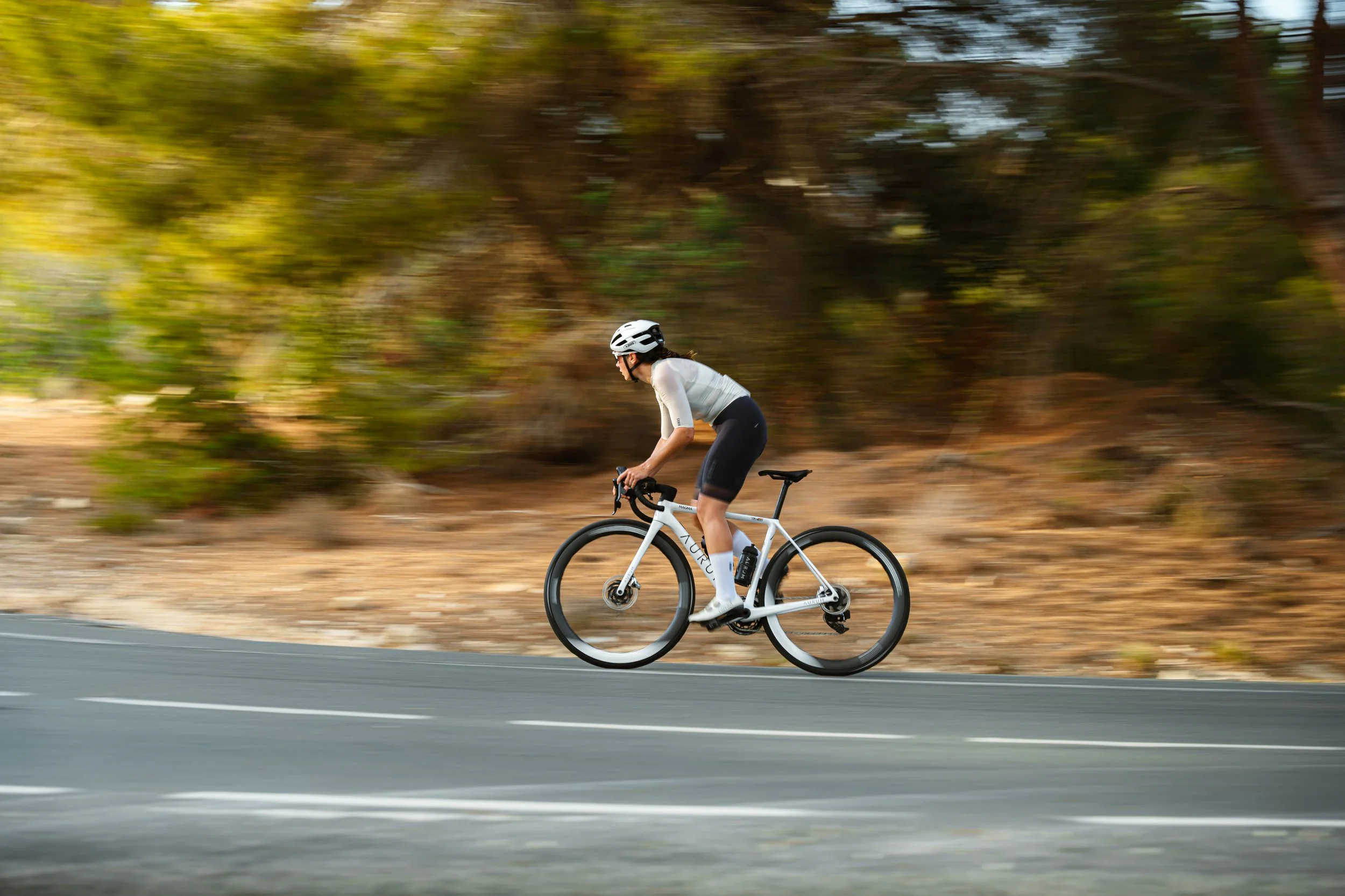 Cyclist in motion on rural road