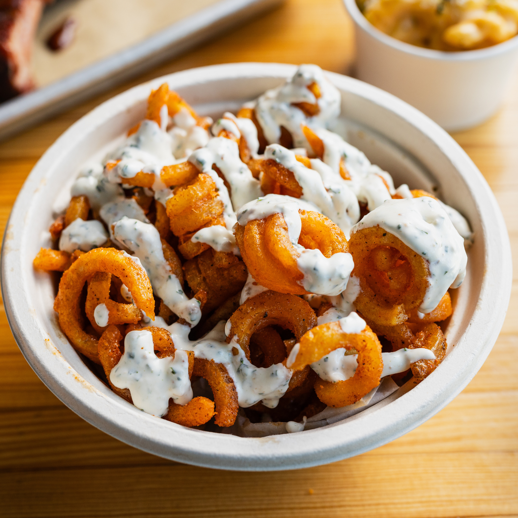 Seasoned Curly Fries with Bacon and Chive Aioli