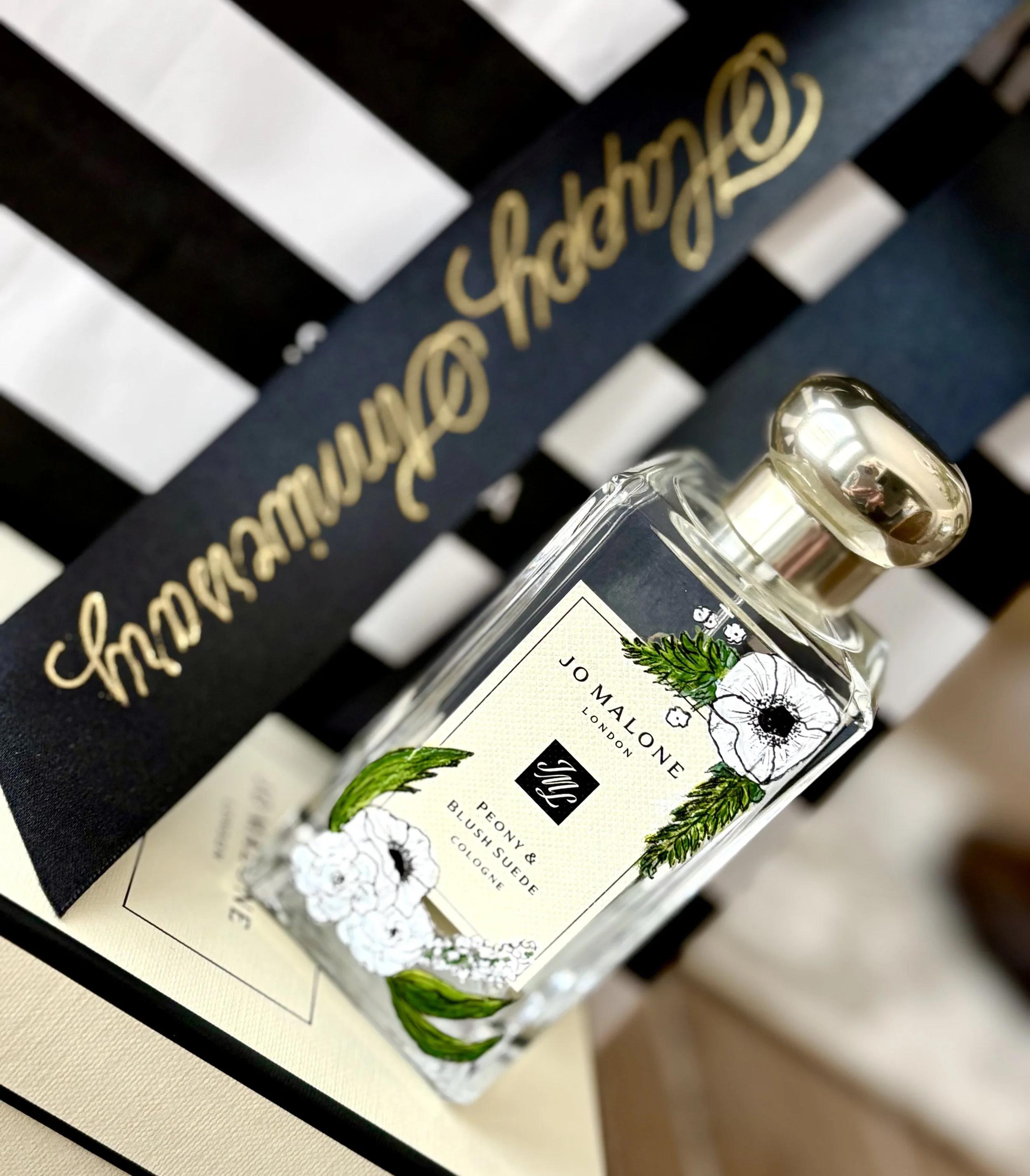 Jo Malone white floral bottle with bag and ribbon.jpg