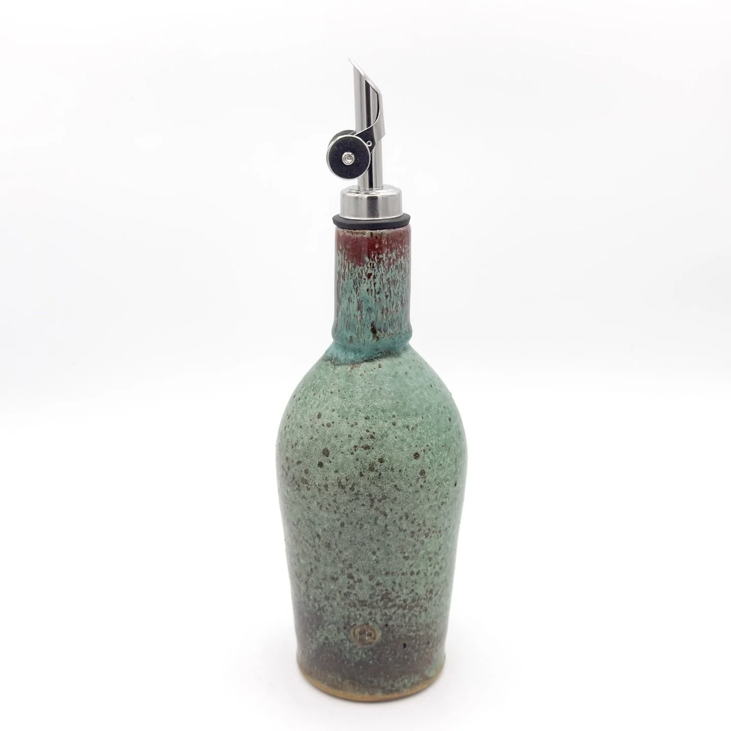 I&rsquo;ve rarely had a surprise like this one during a kiln opening, and I can&rsquo;t get enough of it.

This ruby drip effect was accomplished by layering my white liner glaze over-top the patina glaze of the body. My expectation was a frosted whi