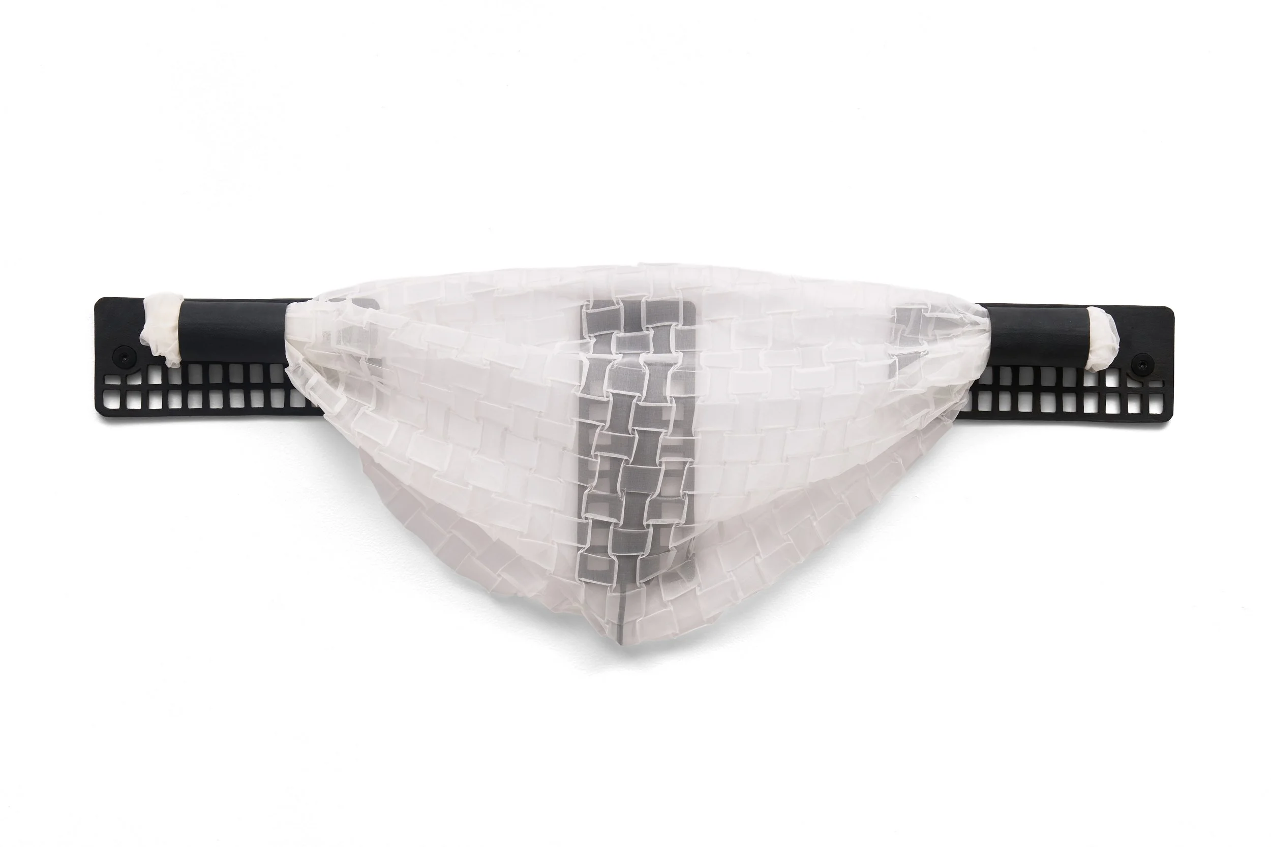 Armament II, 2026, glazed ceramic, silk organza, silicone grommets, 16 x 48.75 x 6 inches.