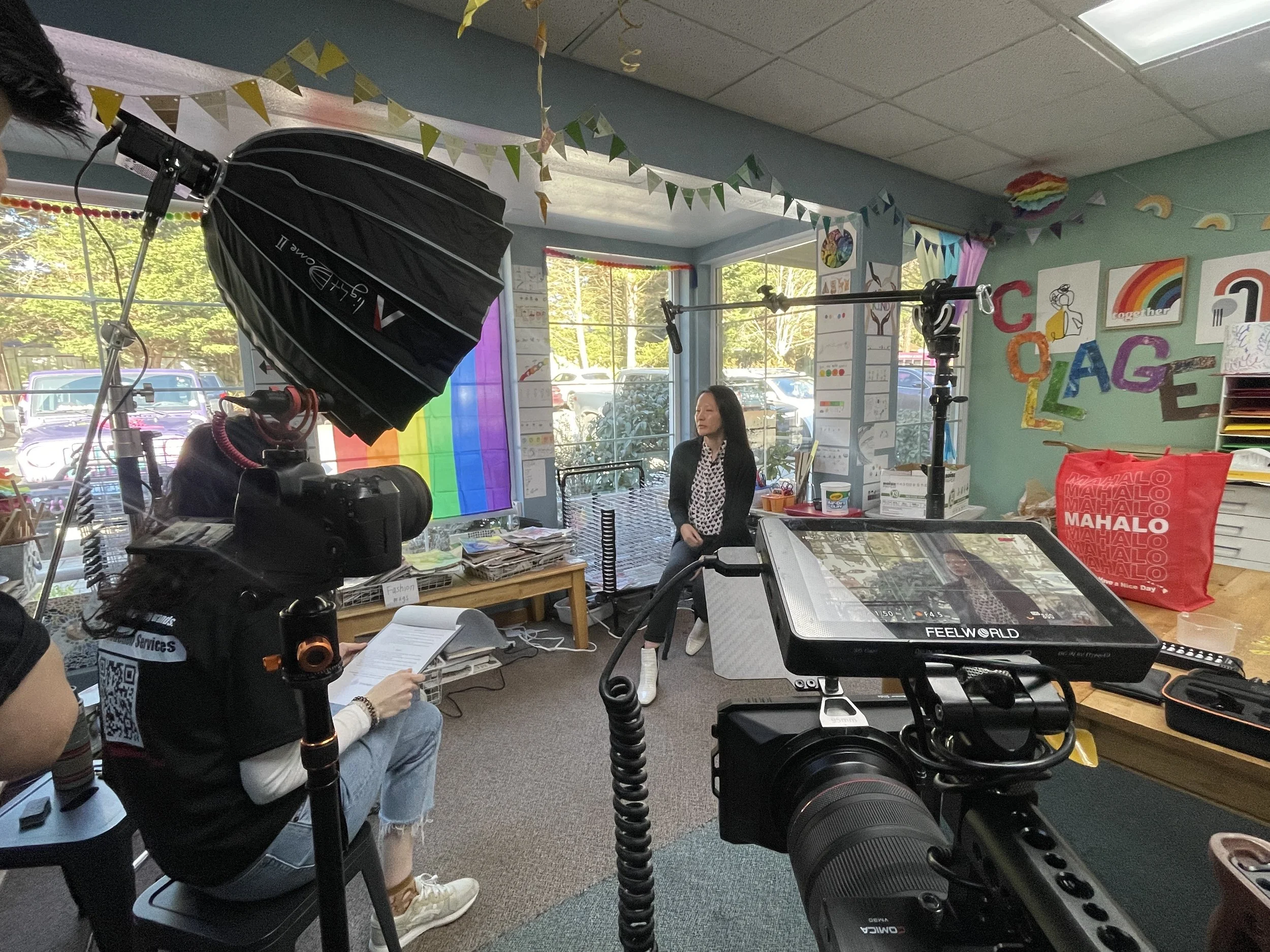 GrowingBoyMedia corporate video production crew filming a business interview in Seattle