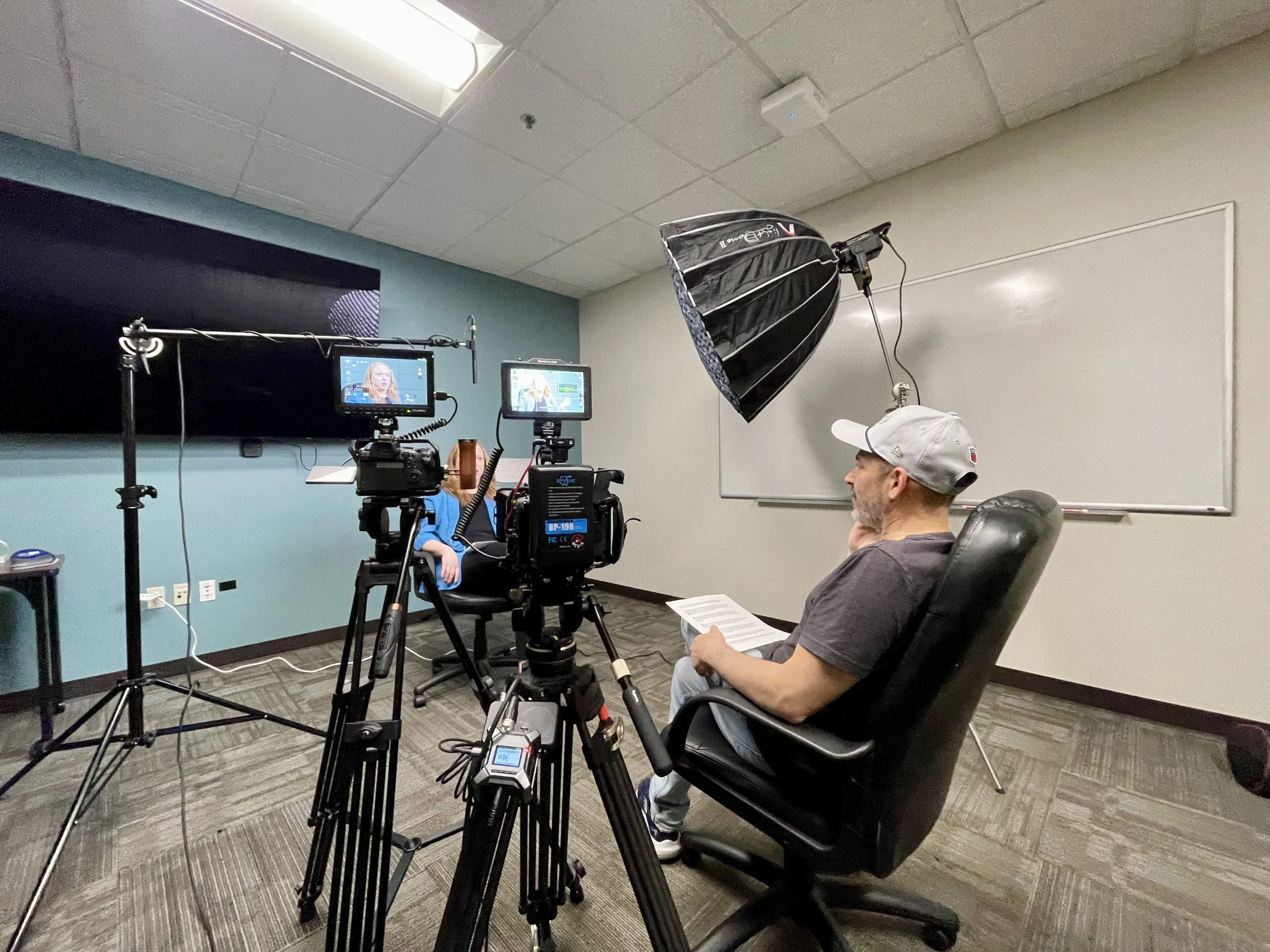 Seattle corporate videographer preparing a client for a professional business interview