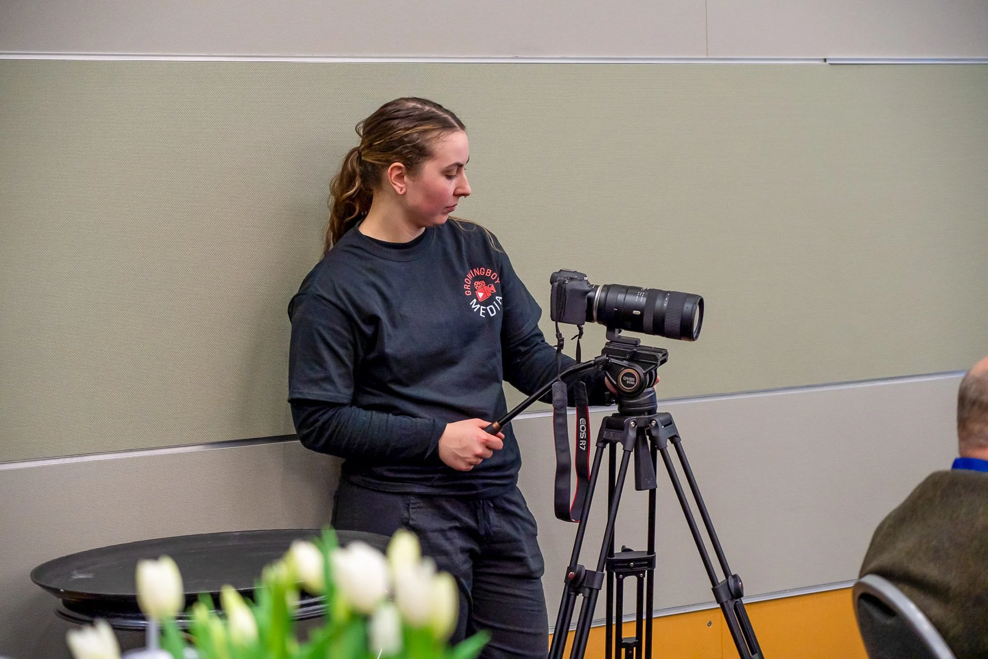GrowingBoyMedia corporate video production crew filming a business interview in Seattle
