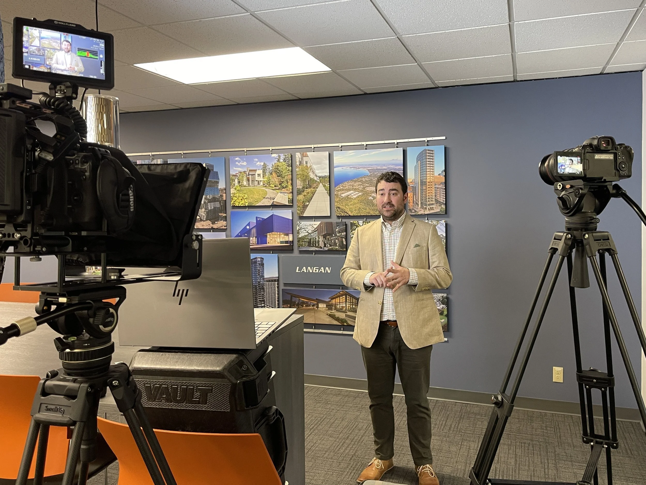 Professional camera gear and lighting setup for corporate communications filming