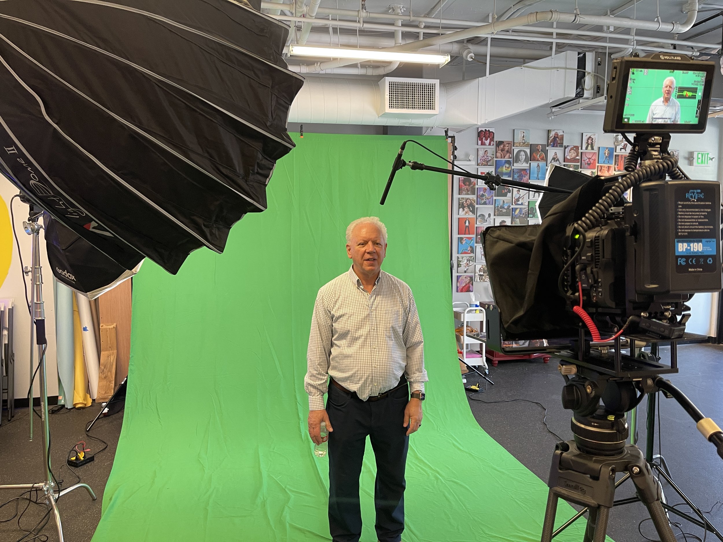 Professional camera gear and lighting setup for corporate communications filming